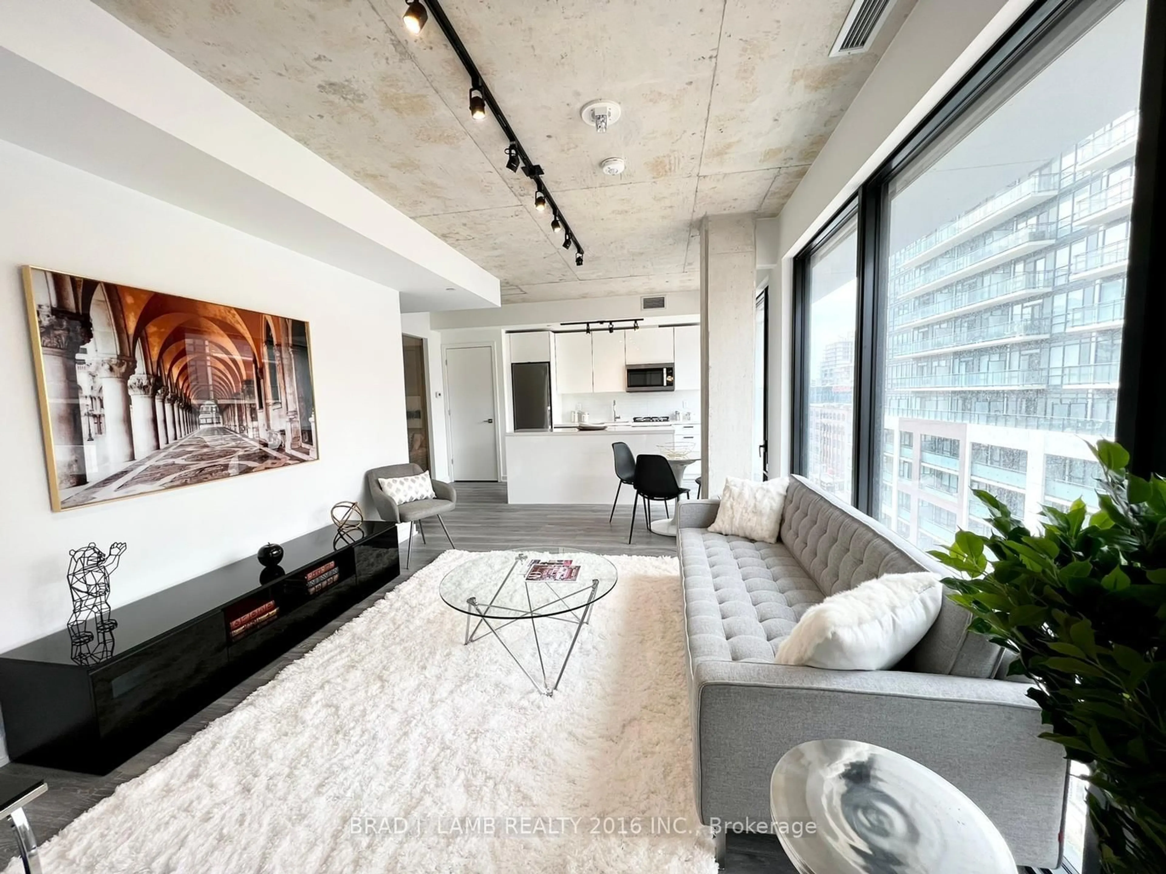 Living room with furniture, cement floor for 55 Ontario St #812, Toronto Ontario M5A 0T8