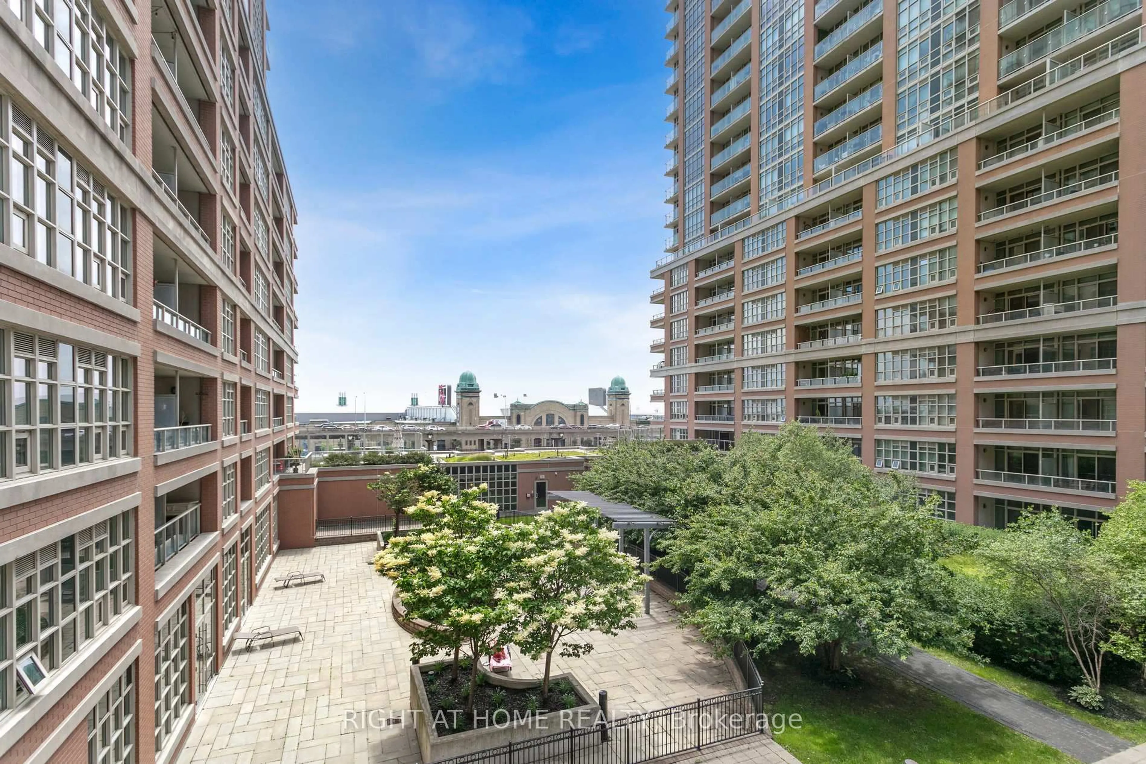 Patio, city buildings view from balcony for 85 East Liberty St #525, Toronto Ontario M6K 3R4