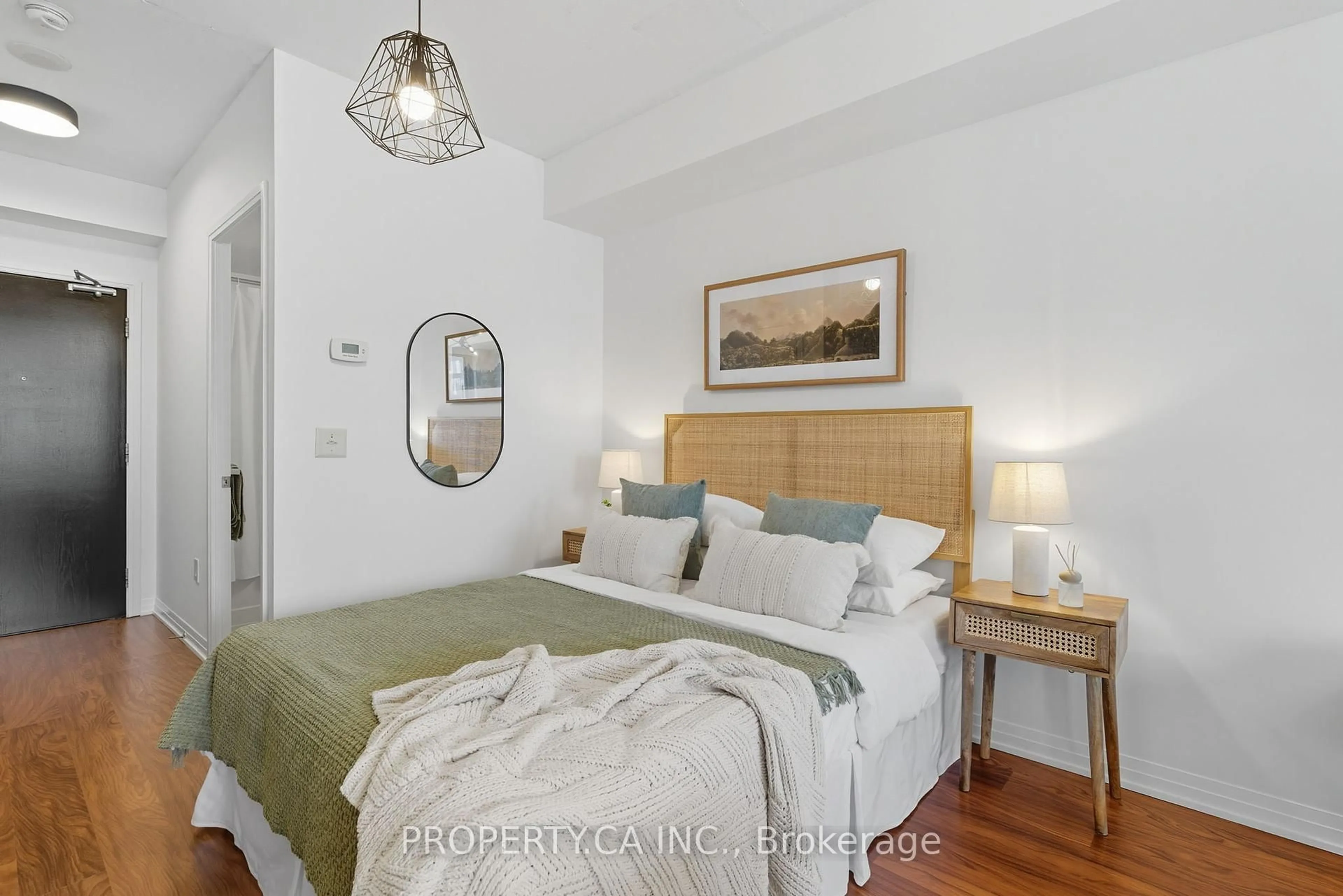 Bedroom with bed, wood/laminate floor for 25 Cole St #720, Toronto Ontario M5A 4M3
