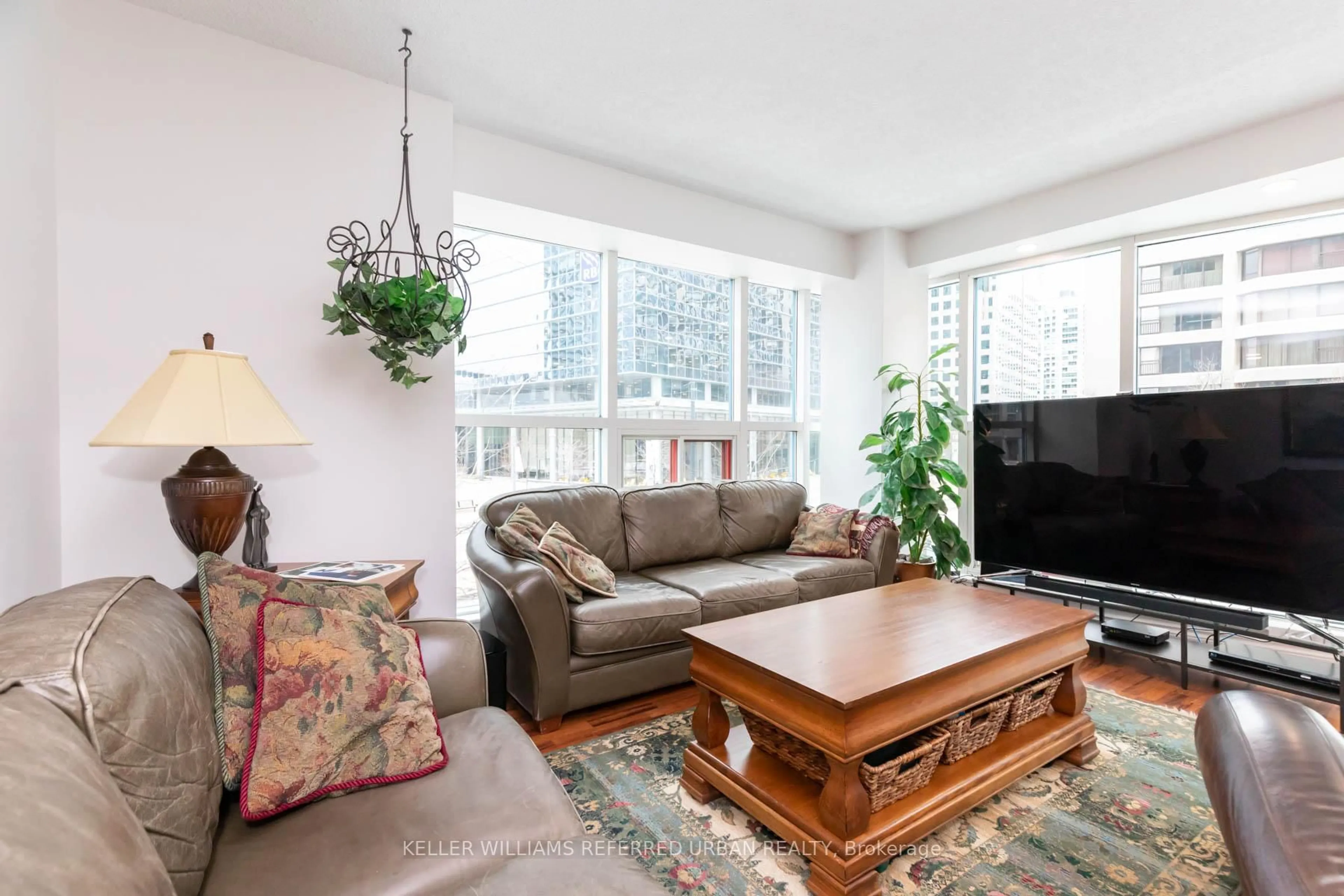 Living room with furniture, unknown for 77 Harbour Sq #302, Toronto Ontario M5J 2S2