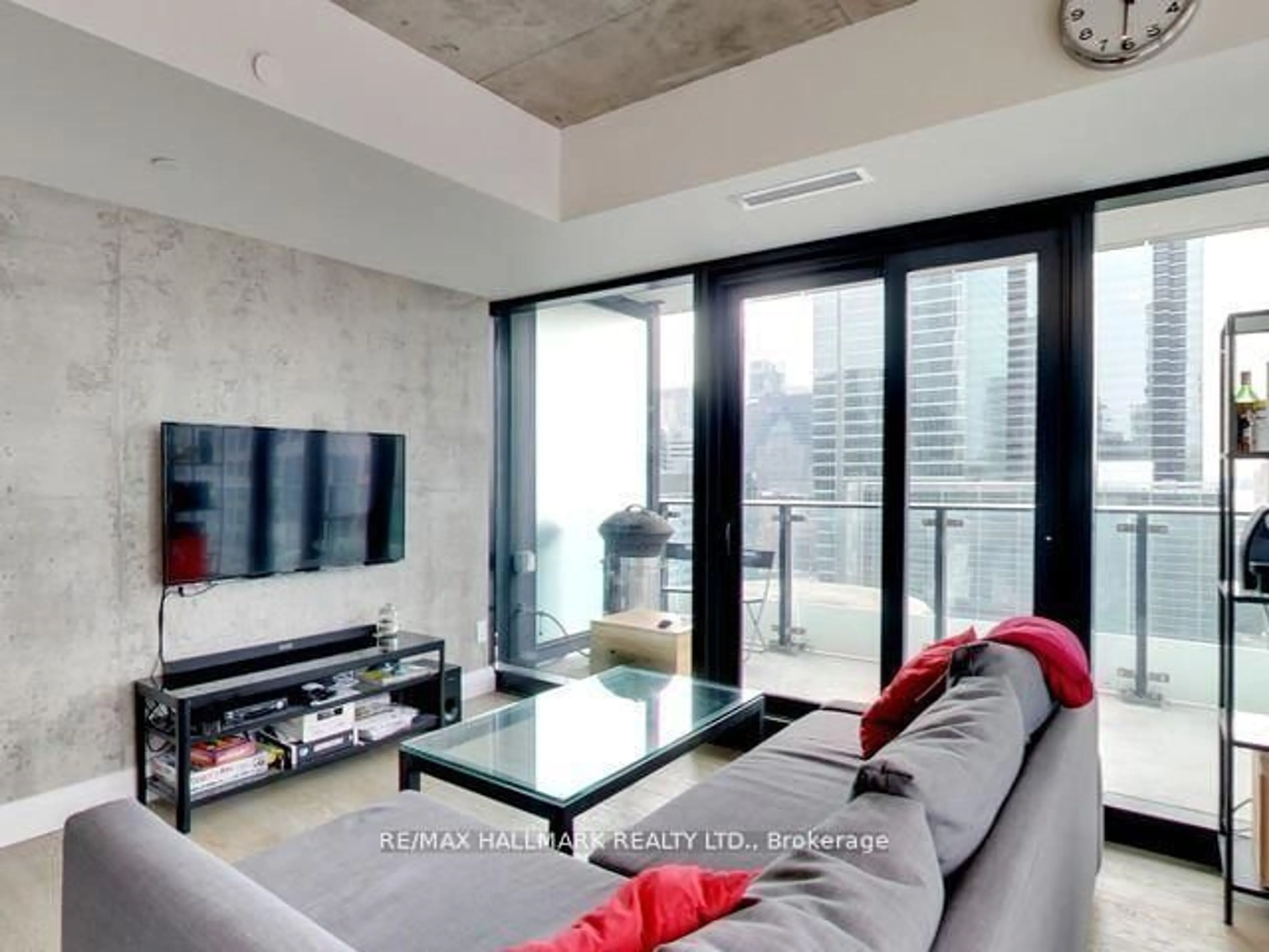 Living room with furniture, cement floor for 224 King St #1407, Toronto Ontario M5H 0A6