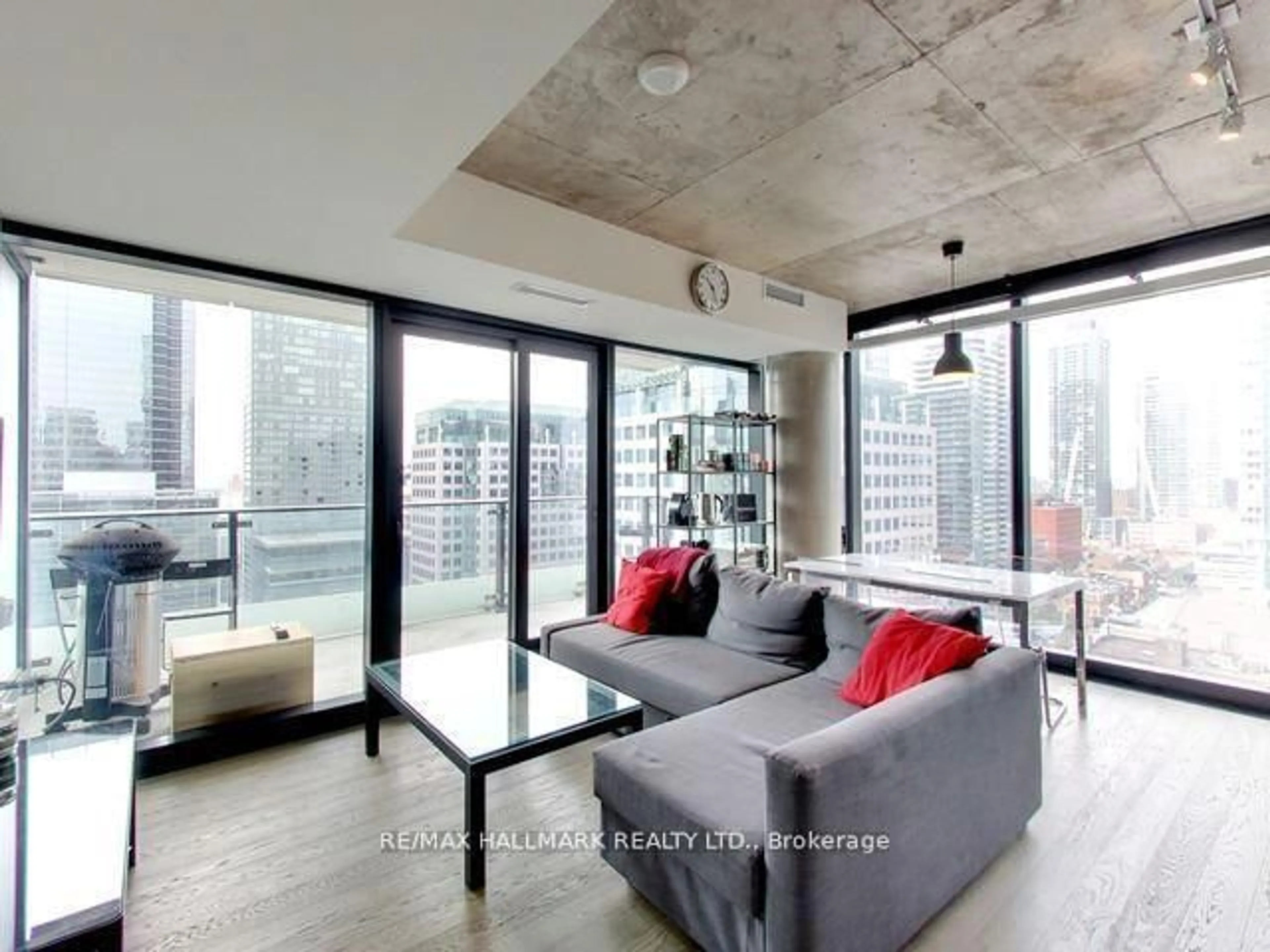 Living room with furniture, cement floor for 224 King St #1407, Toronto Ontario M5H 0A6