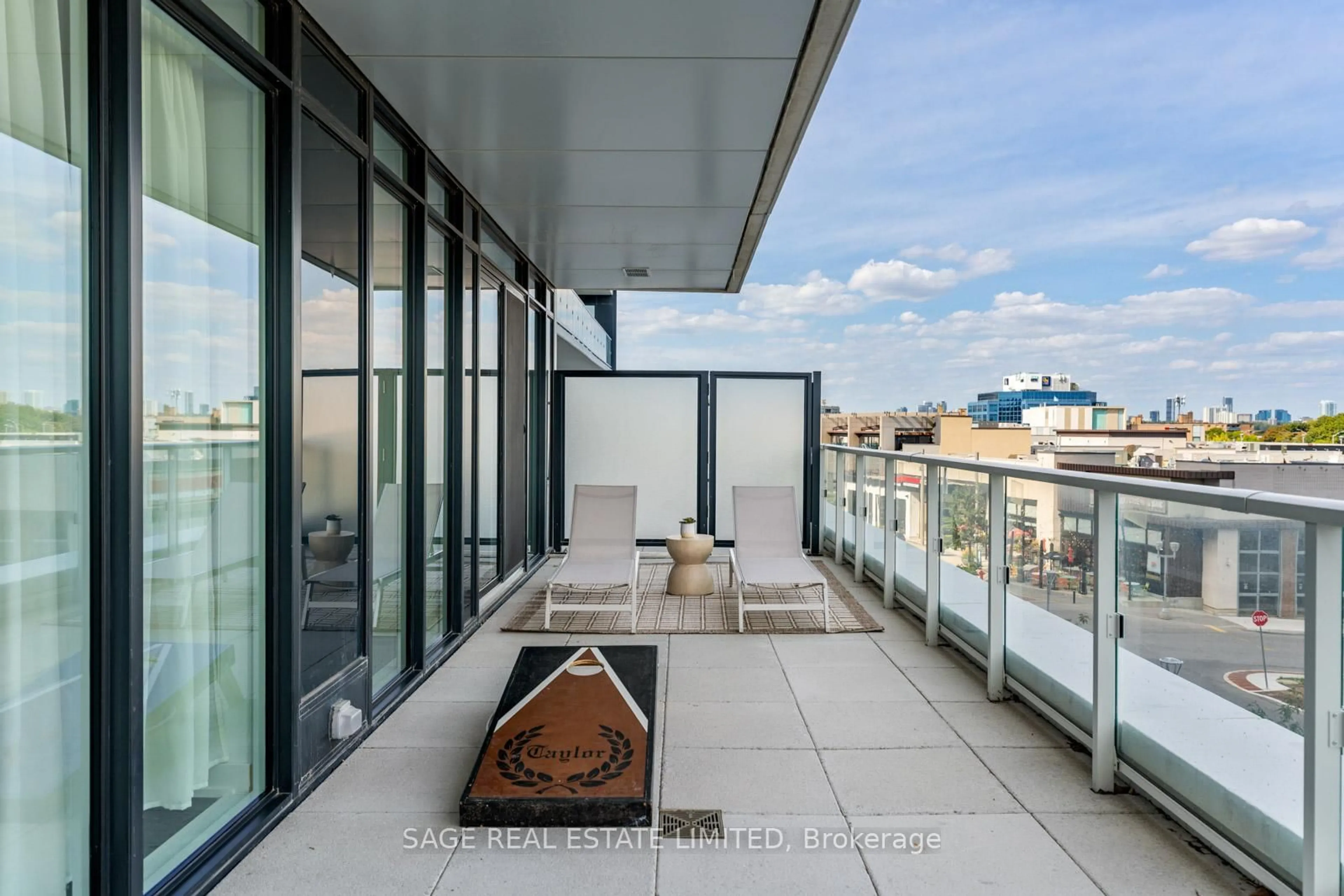 Patio, city buildings view from balcony for 50 O'neill Rd #212, Toronto Ontario M3C 0R1