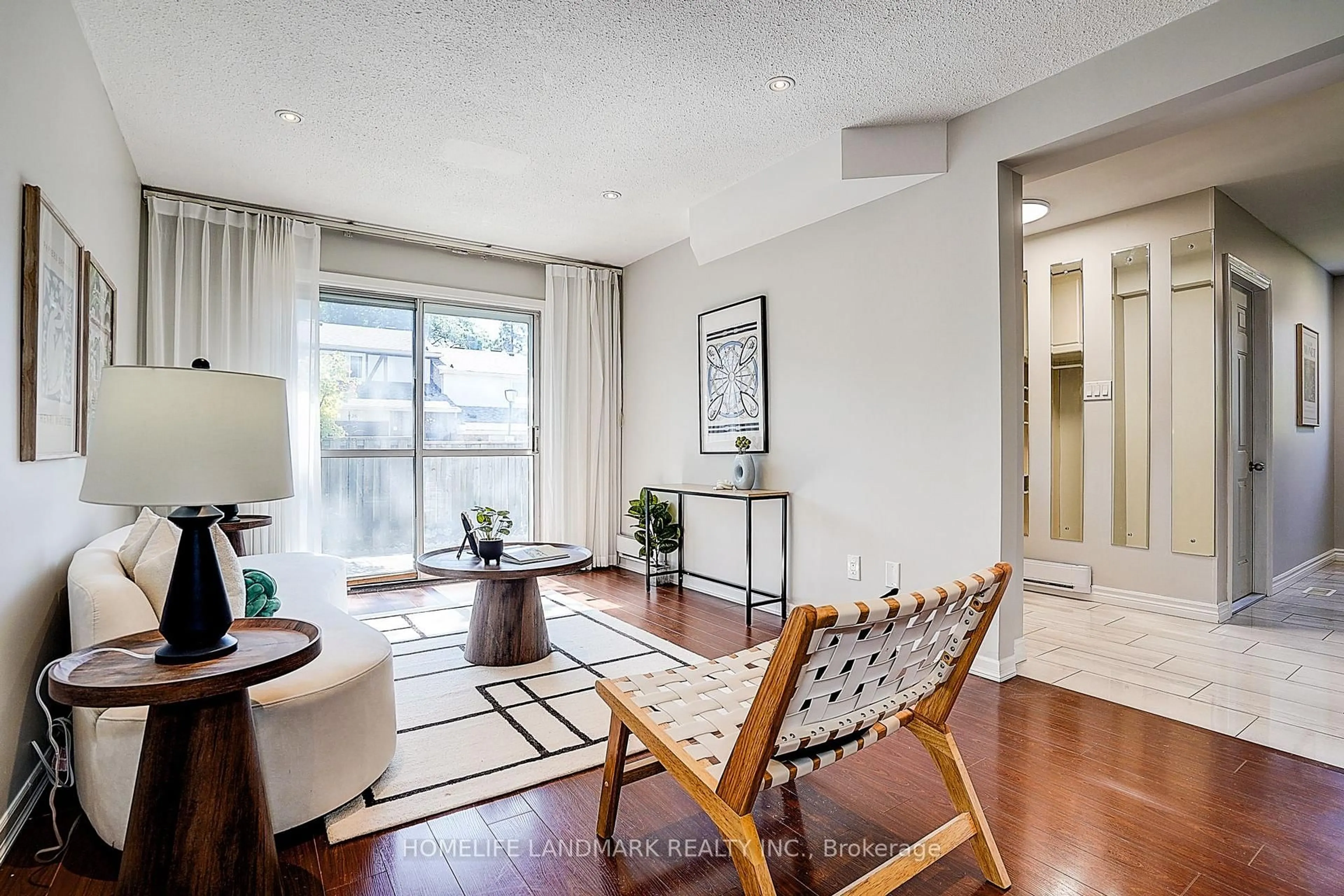 Living room with furniture, wood/laminate floor for 25 Bracken Fernway, Toronto Ontario M2J 4L5
