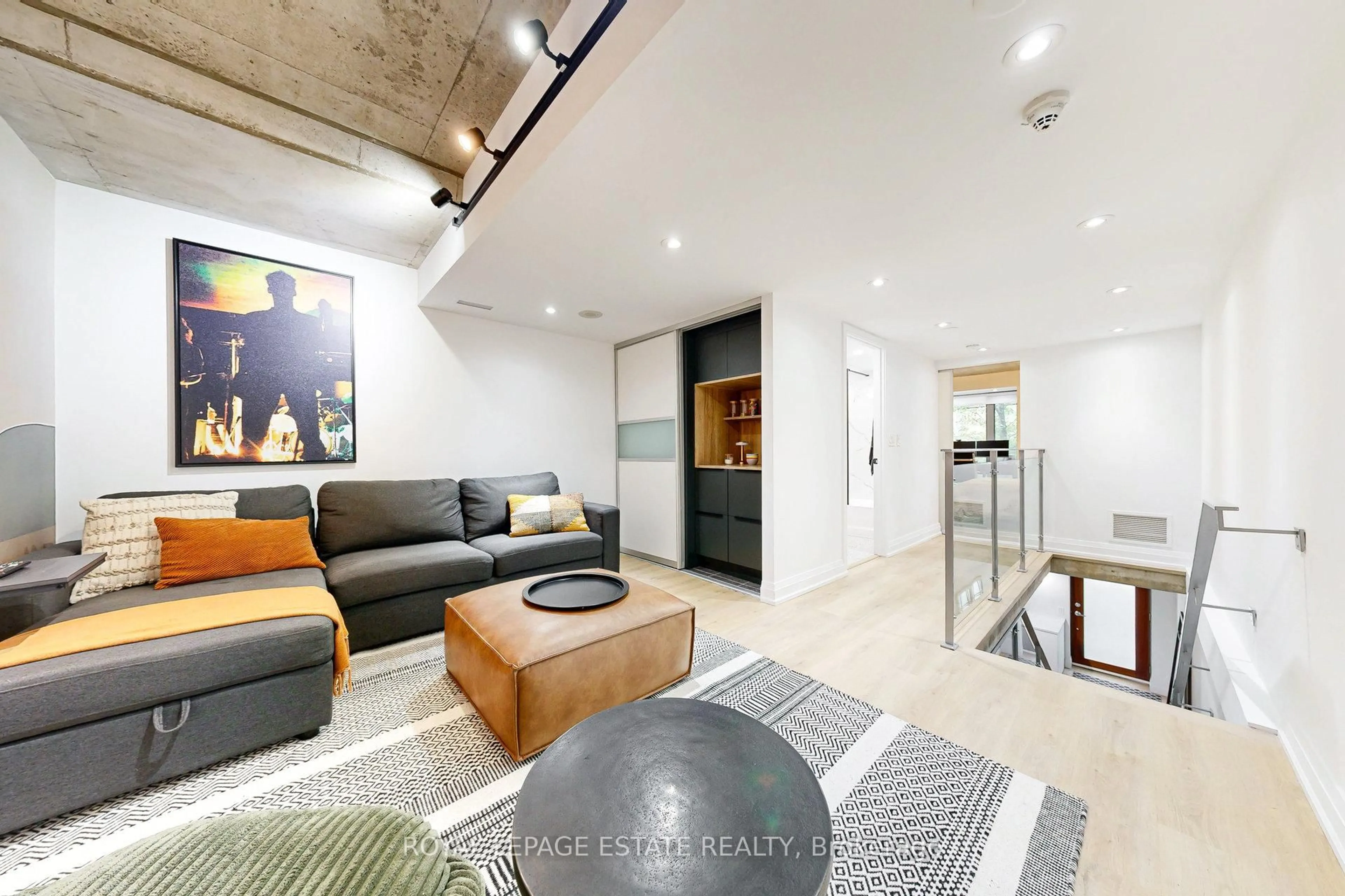 Living room with furniture, cement floor for 55 Stewart St #110, Toronto Ontario M5V 2V1