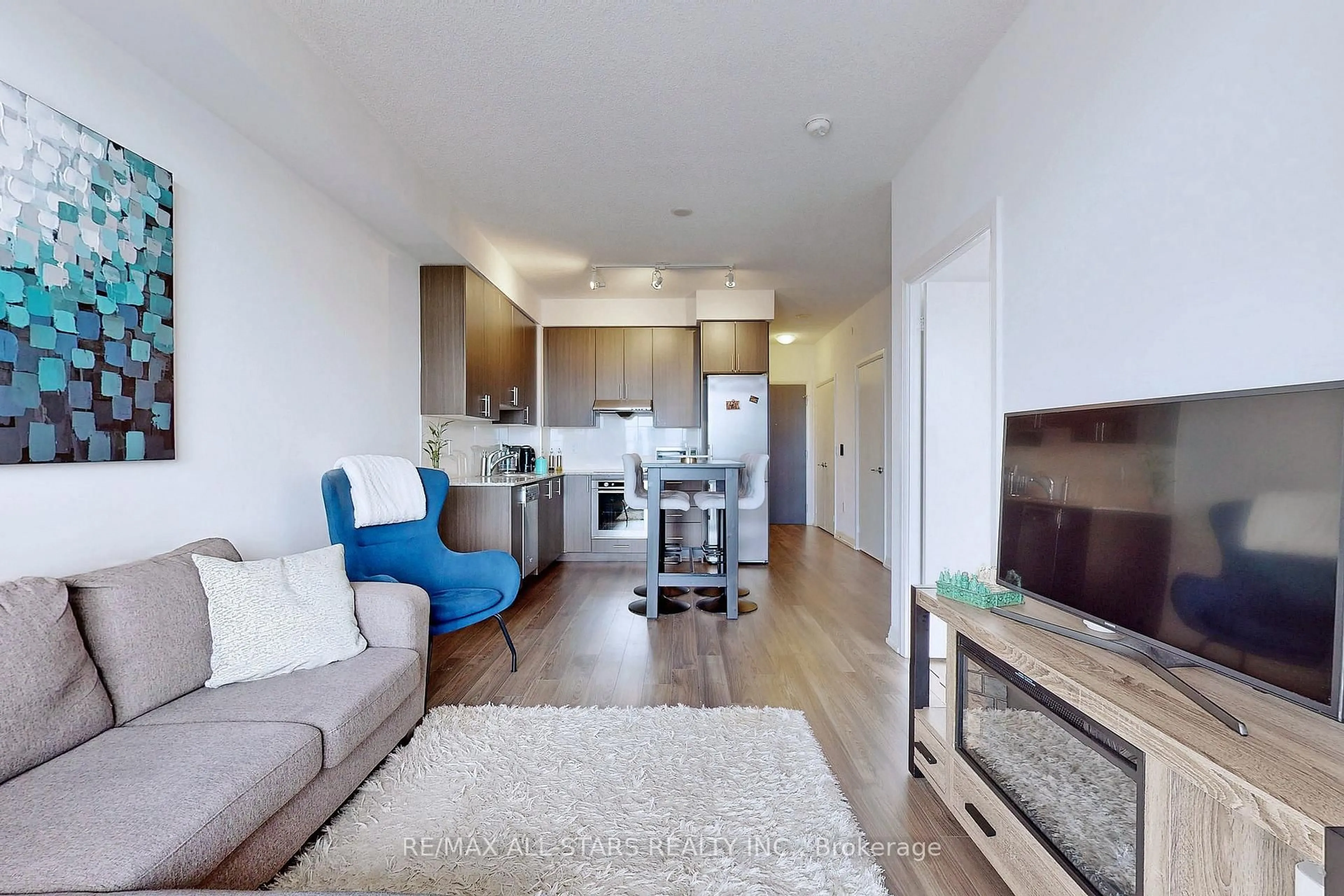 Living room with furniture, wood/laminate floor for 55 Ann O'Reilly Rd #1709, Toronto Ontario M2J 0E1