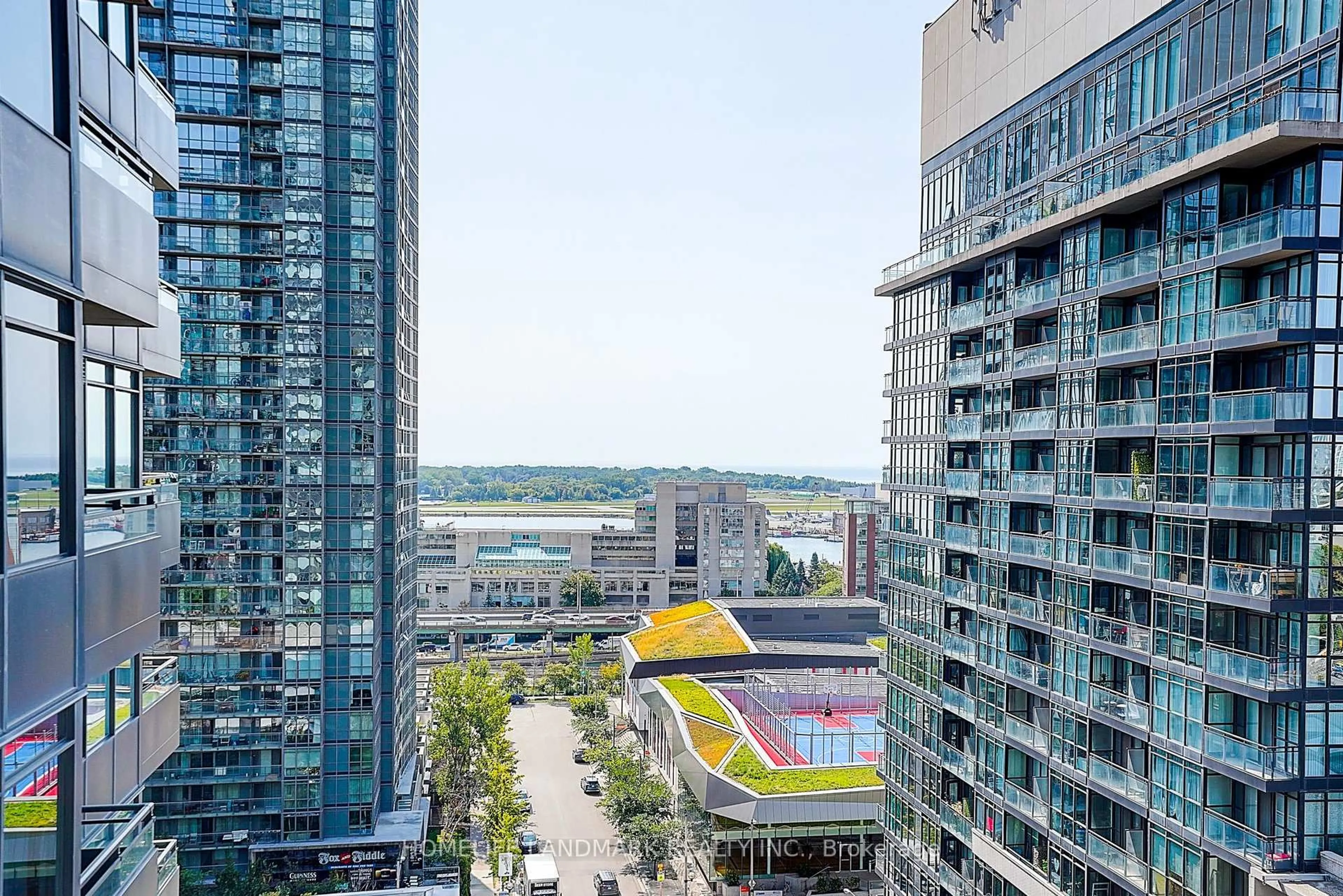 Patio, city buildings view from balcony for 25 Telegram Mews #1612, Toronto Ontario M5V 3Z1