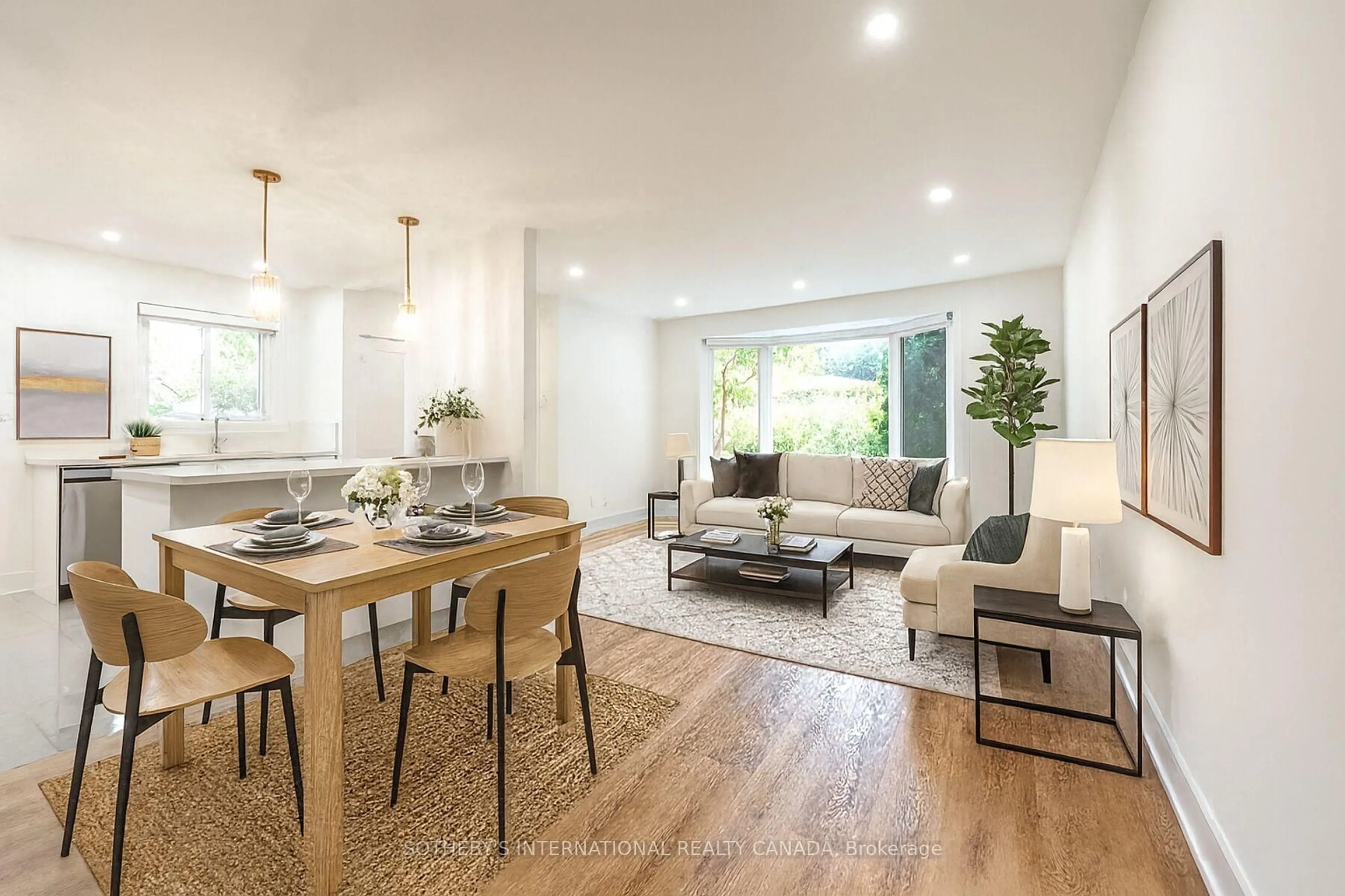 Living room with furniture, wood/laminate floor for 105 Baltray Cres, Toronto Ontario M3A 2H5