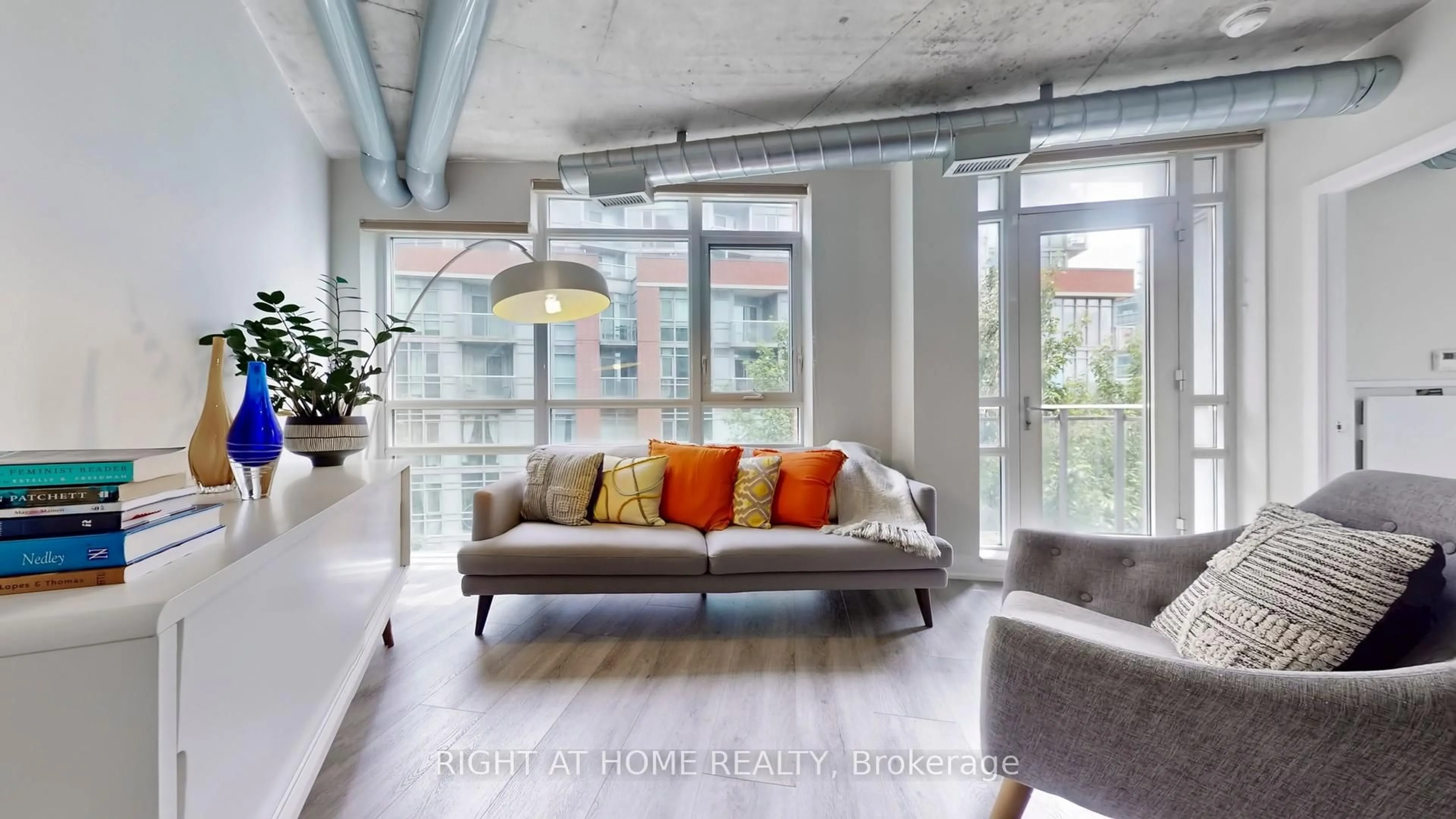 Living room with furniture, cement floor for 170 Sudbury St #415, Toronto Ontario M6J 0A1