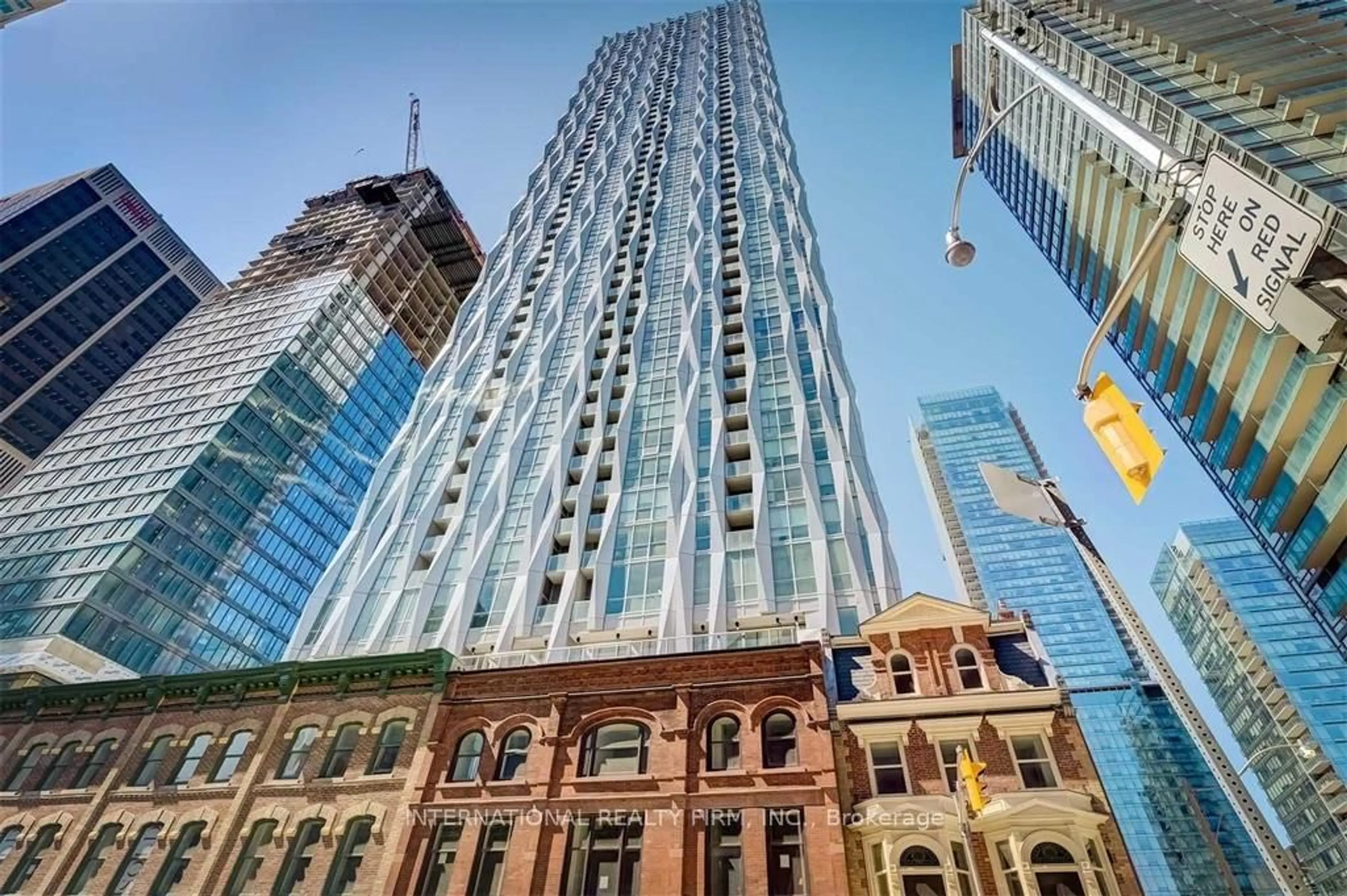 A pic from outside/outdoor area/front of a property/back of a property/a pic from drone, building for 1 Yorkville Ave #5409, Toronto Ontario M4W 0B1