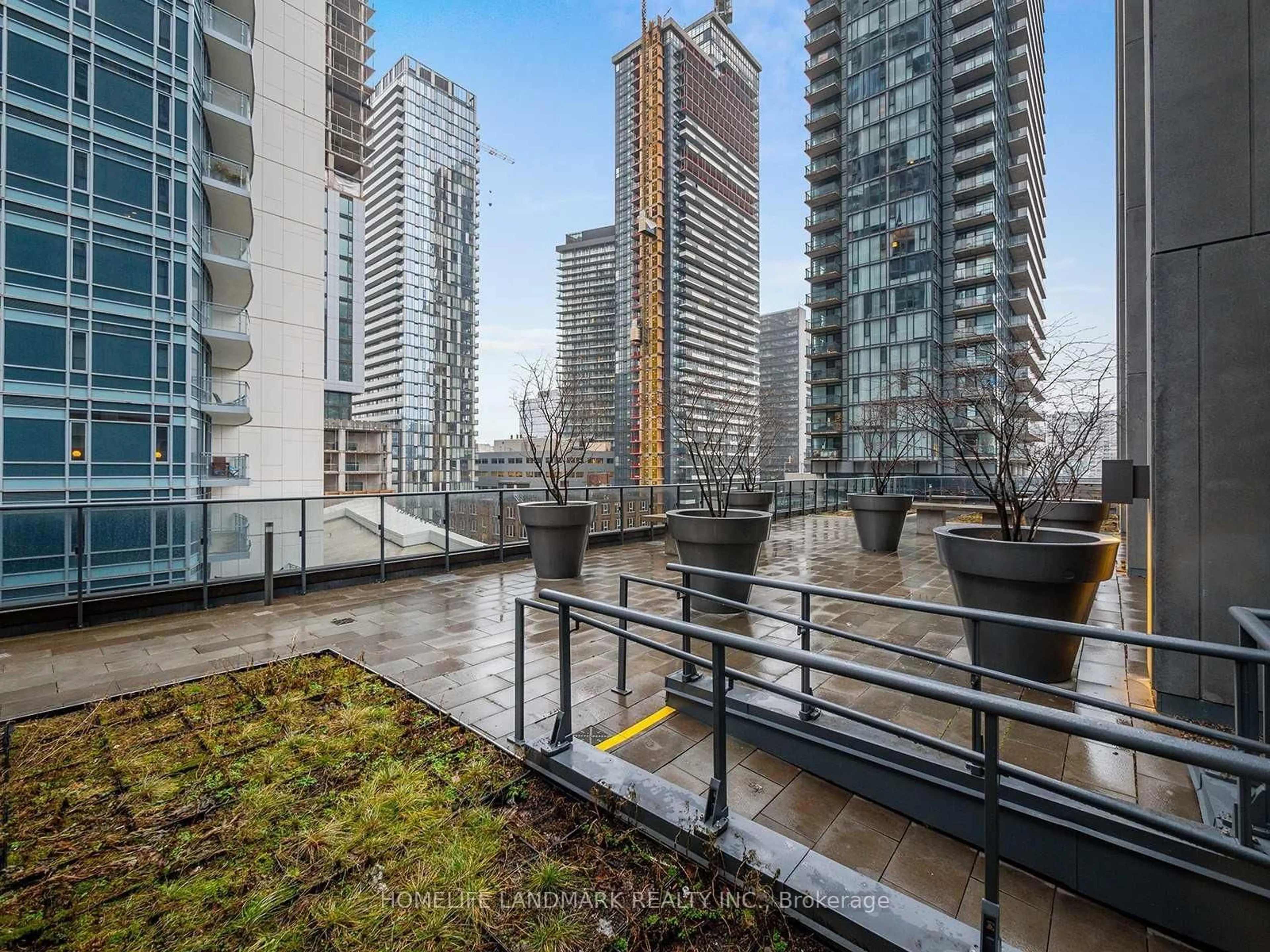 Patio, city buildings view from balcony for 295 Adelaide St #3010, Toronto Ontario M5V 1P7