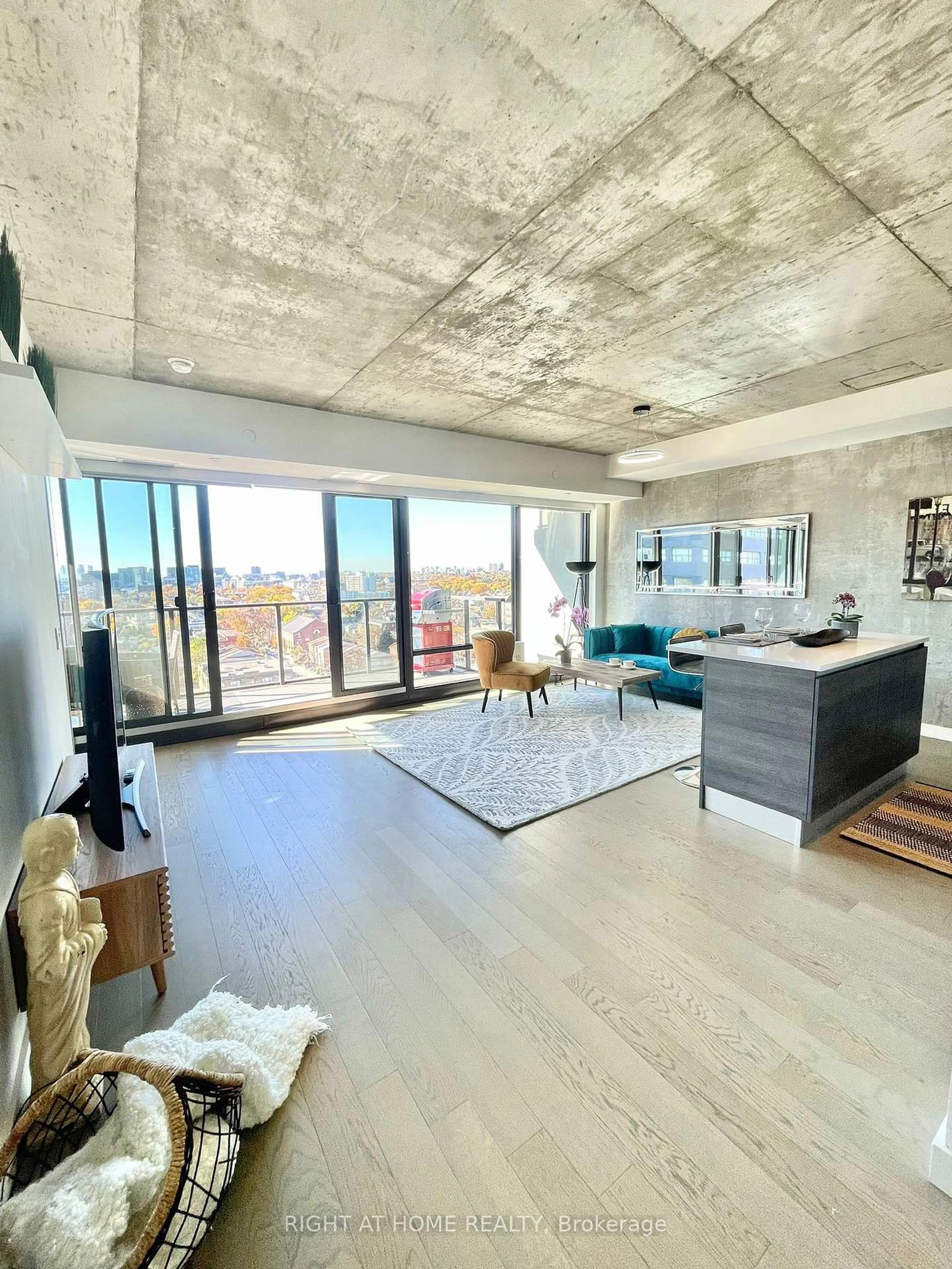 Living room with furniture, cement floor for 111 Bathurst St #1205, Toronto Ontario M5V 2R1
