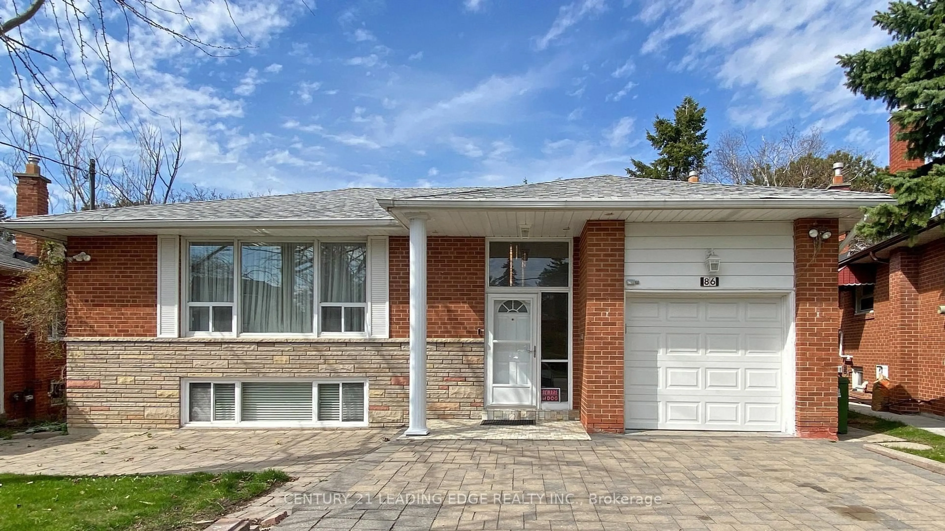 Home with brick exterior material, street for 78 RUSCICA Dr, Toronto Ontario M4A 1R4