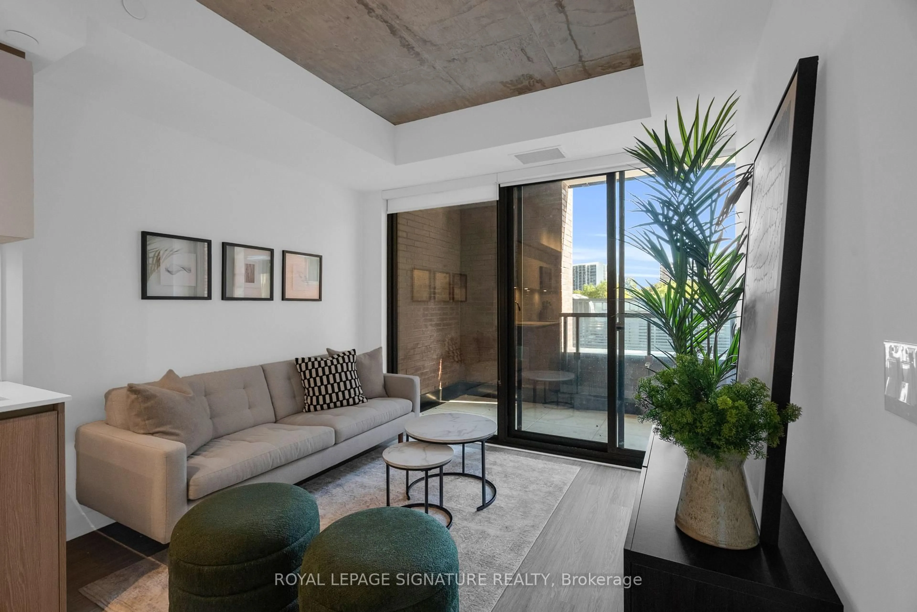 Living room with furniture, cement floor for 47 Mutual St #307, Toronto Ontario M5B 0C6