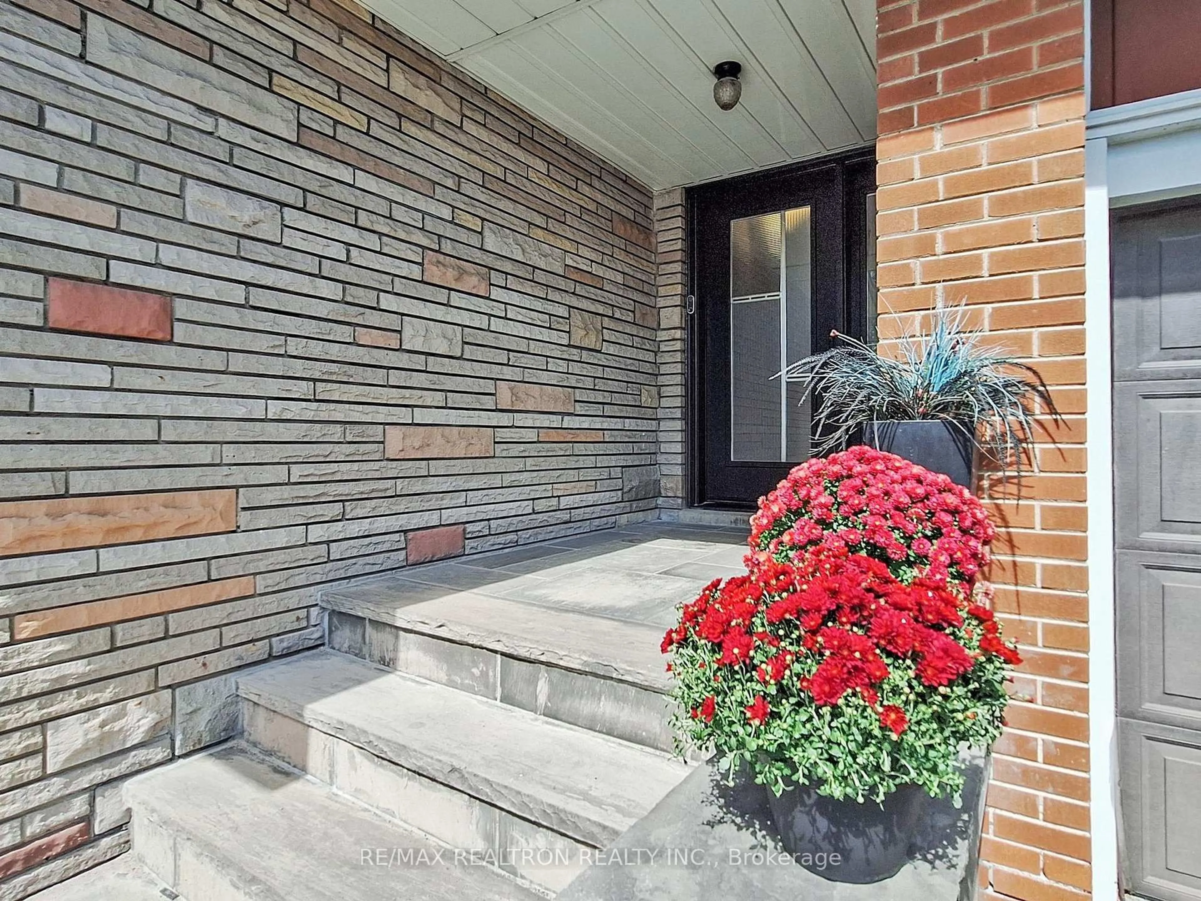 Home with brick exterior material, street for 84 Ruscica Dr, Toronto Ontario M4A 1R4