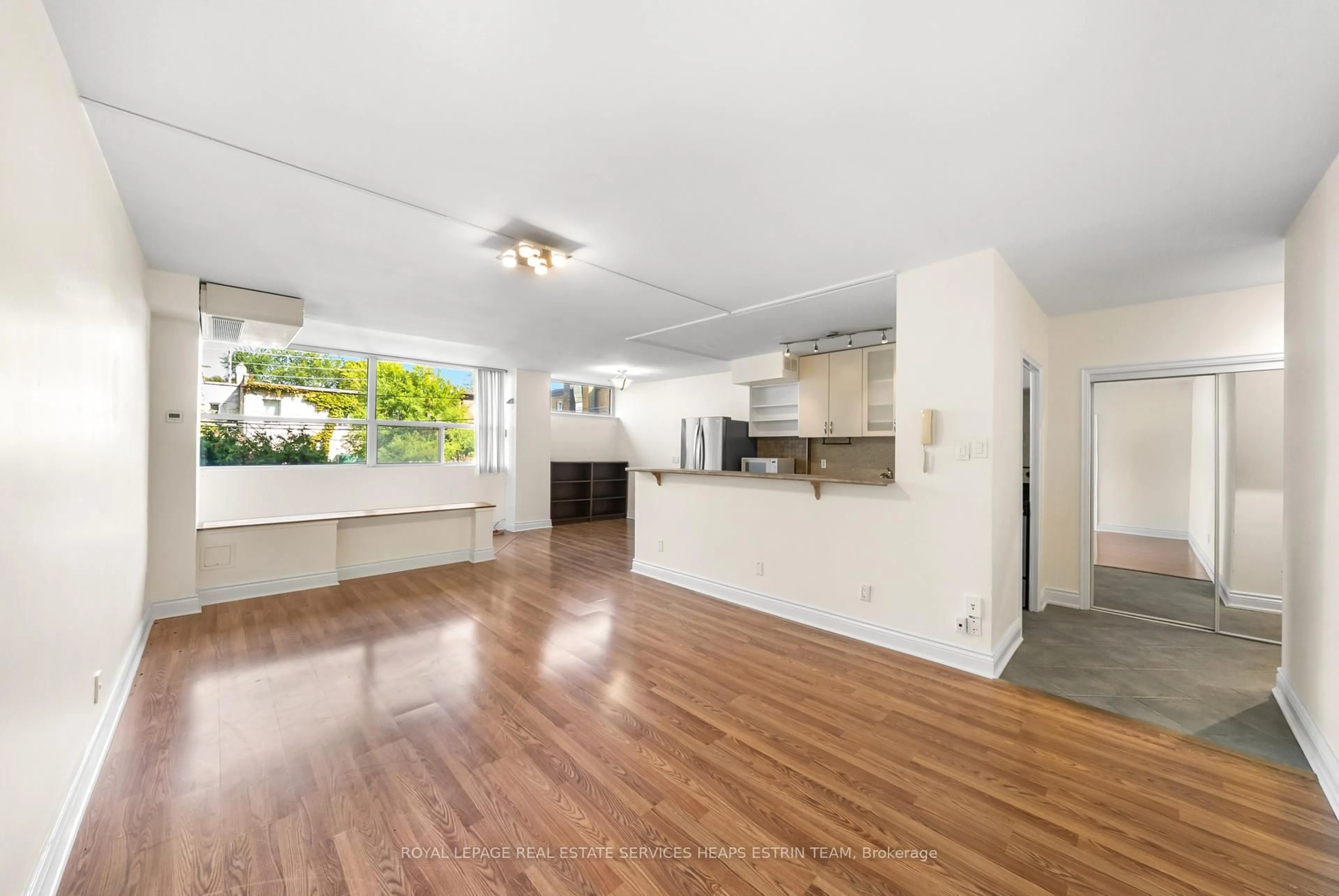 Open concept kitchen, wood/laminate floor for 60 Montclair Ave #202, Toronto Ontario M5P 1P7