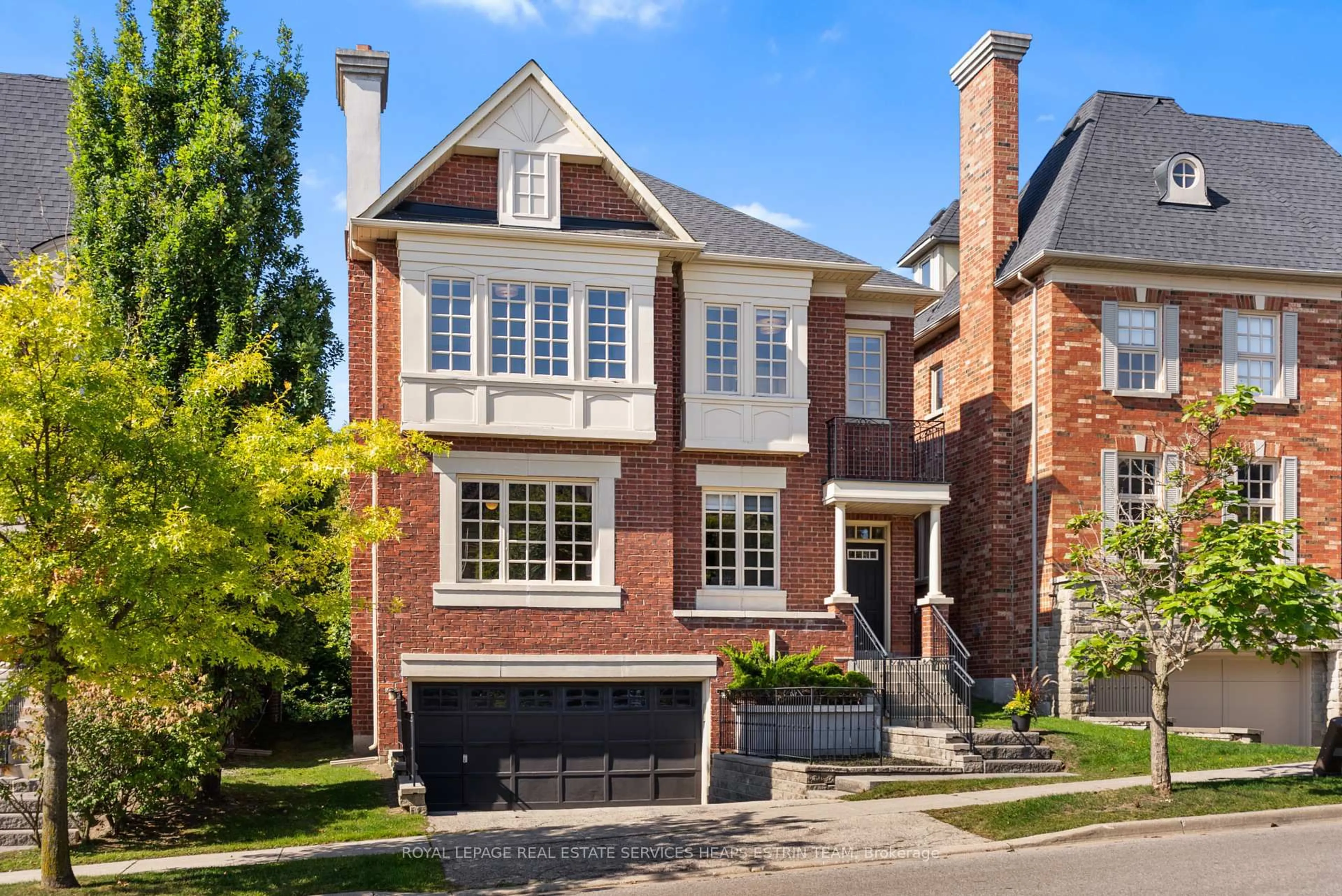 Home with brick exterior material, street for 44 True Davidson Dr, Toronto Ontario M4W 3X5