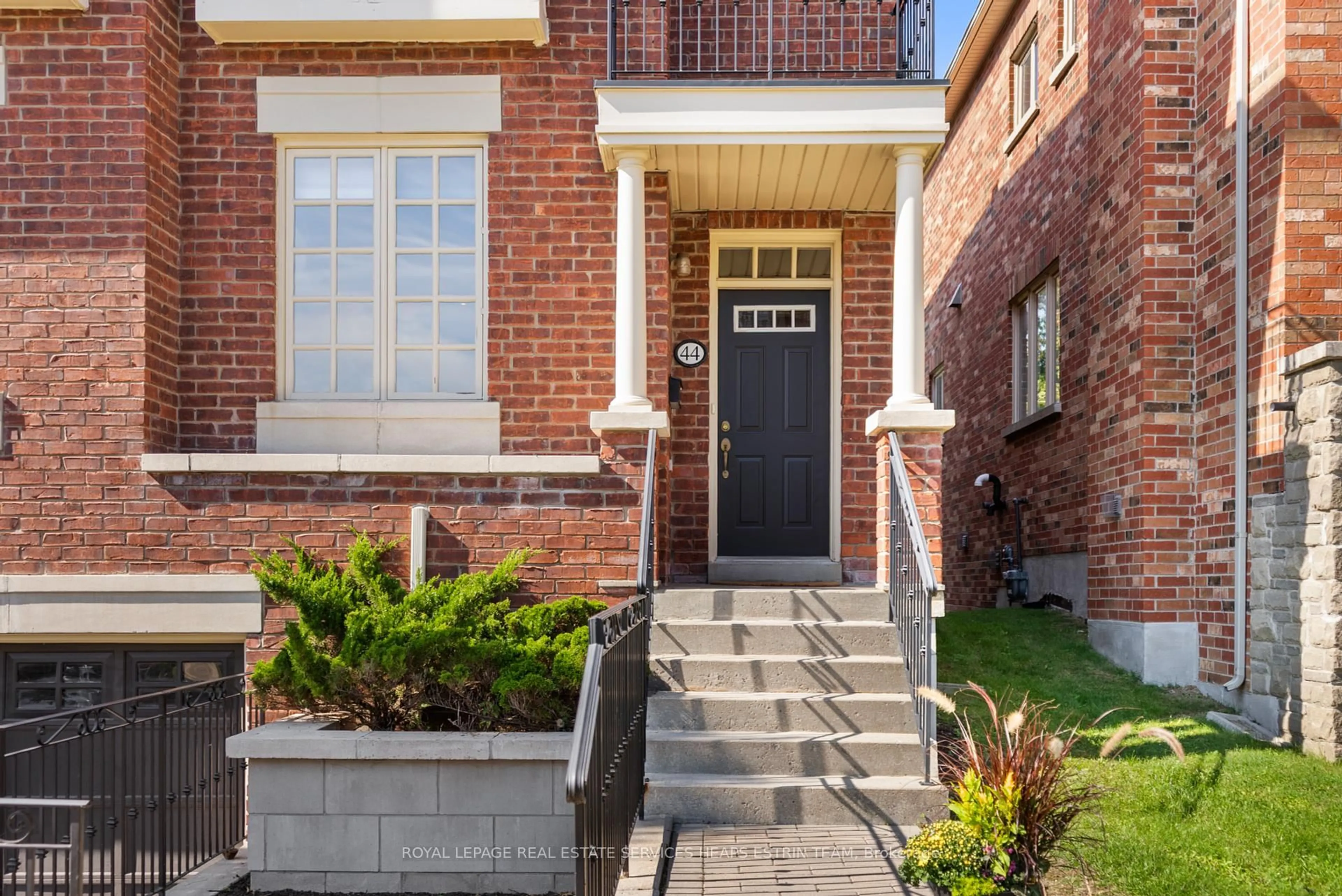 Home with brick exterior material, street for 44 True Davidson Dr, Toronto Ontario M4W 3X5