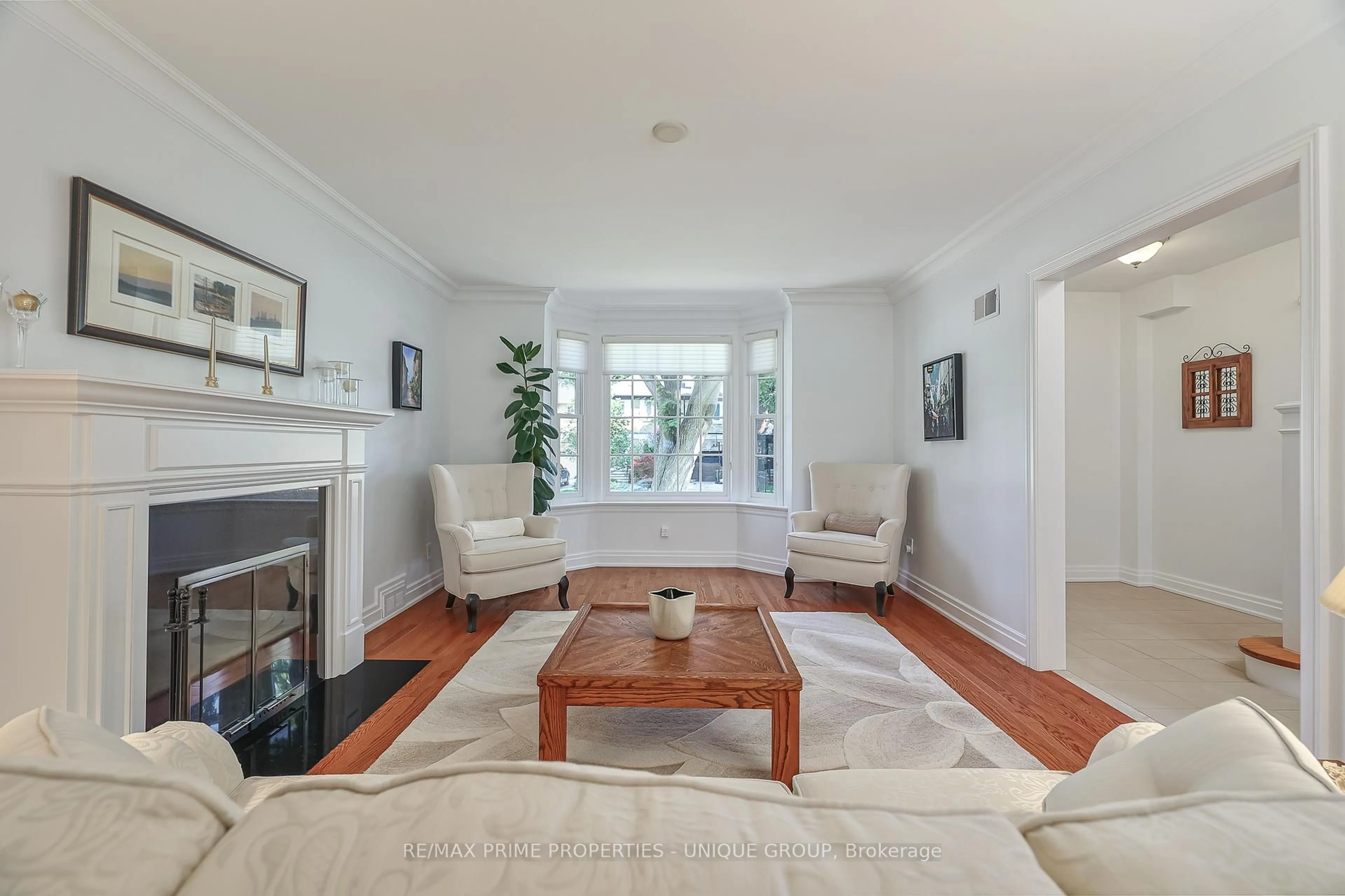 Living room with furniture, wood/laminate floor for 4 Tanager Ave, Toronto Ontario M4G 3R1