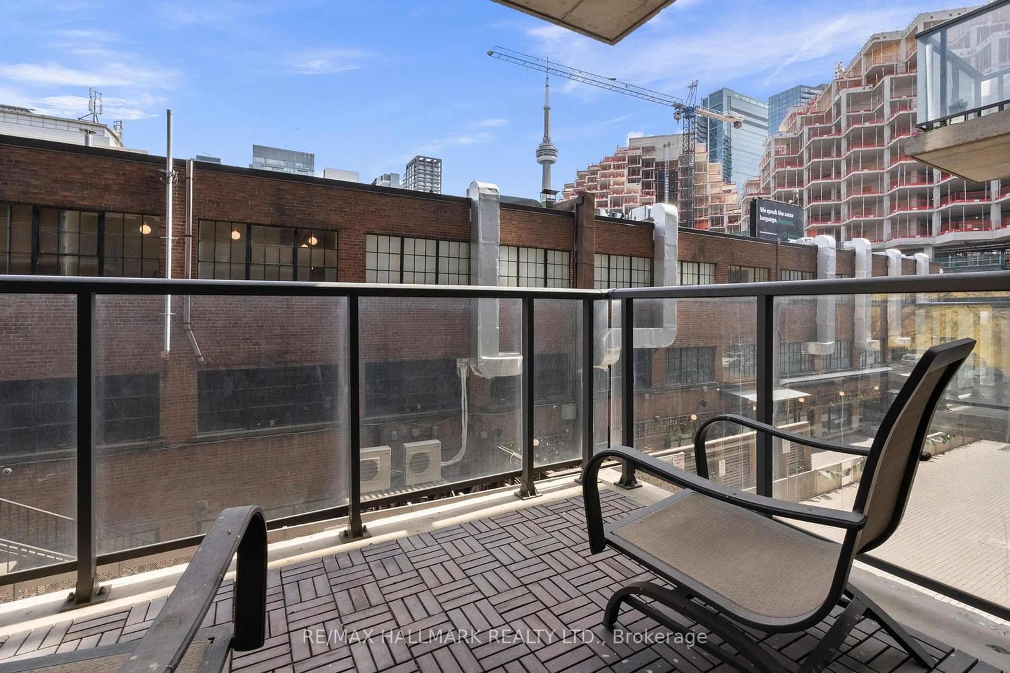 Patio, city buildings view from balcony for 560 King St #206, Toronto Ontario M5V 0L6