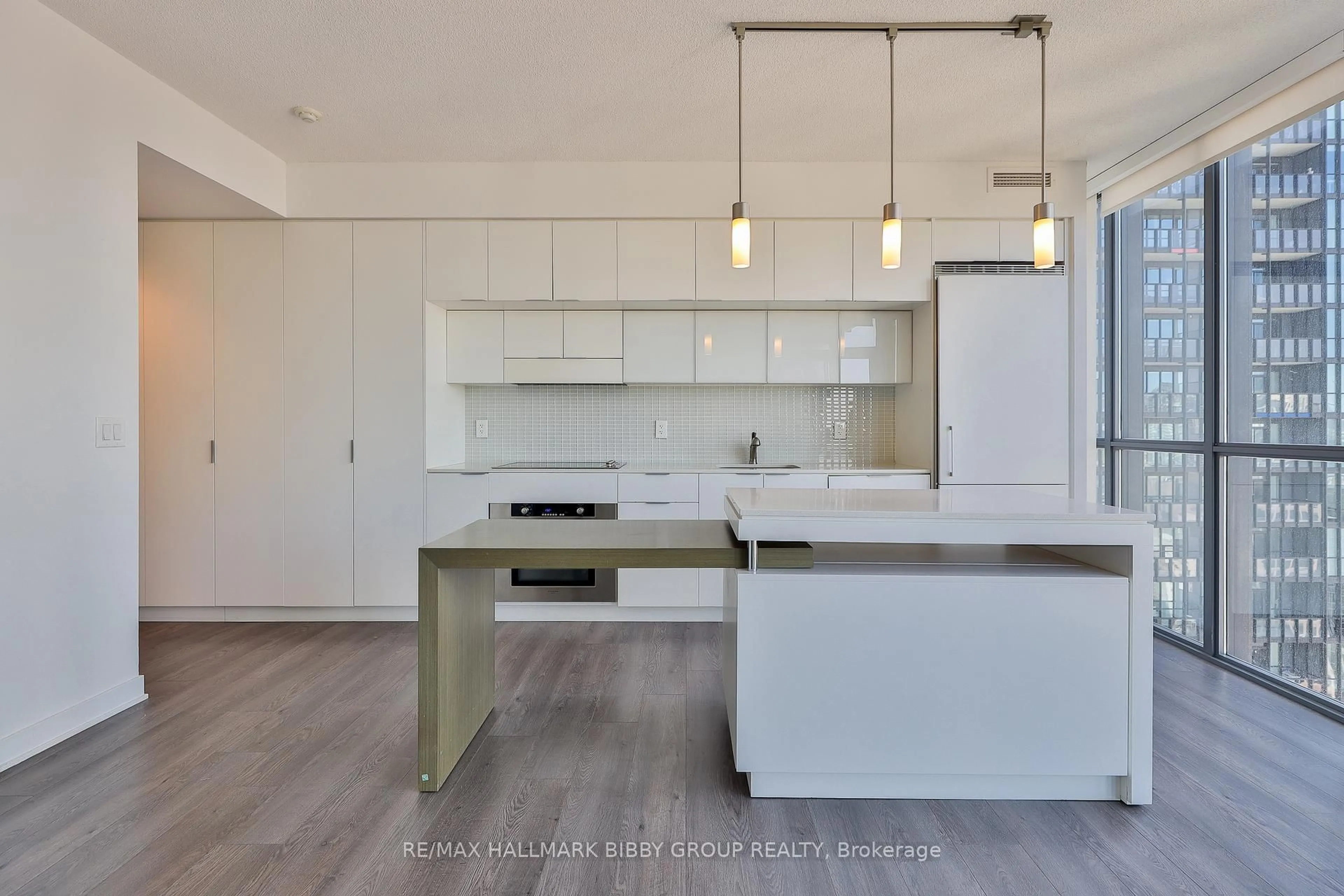 Open concept kitchen, wood/laminate floor for 110 Charles St #2904, Toronto Ontario M4Y 1T5