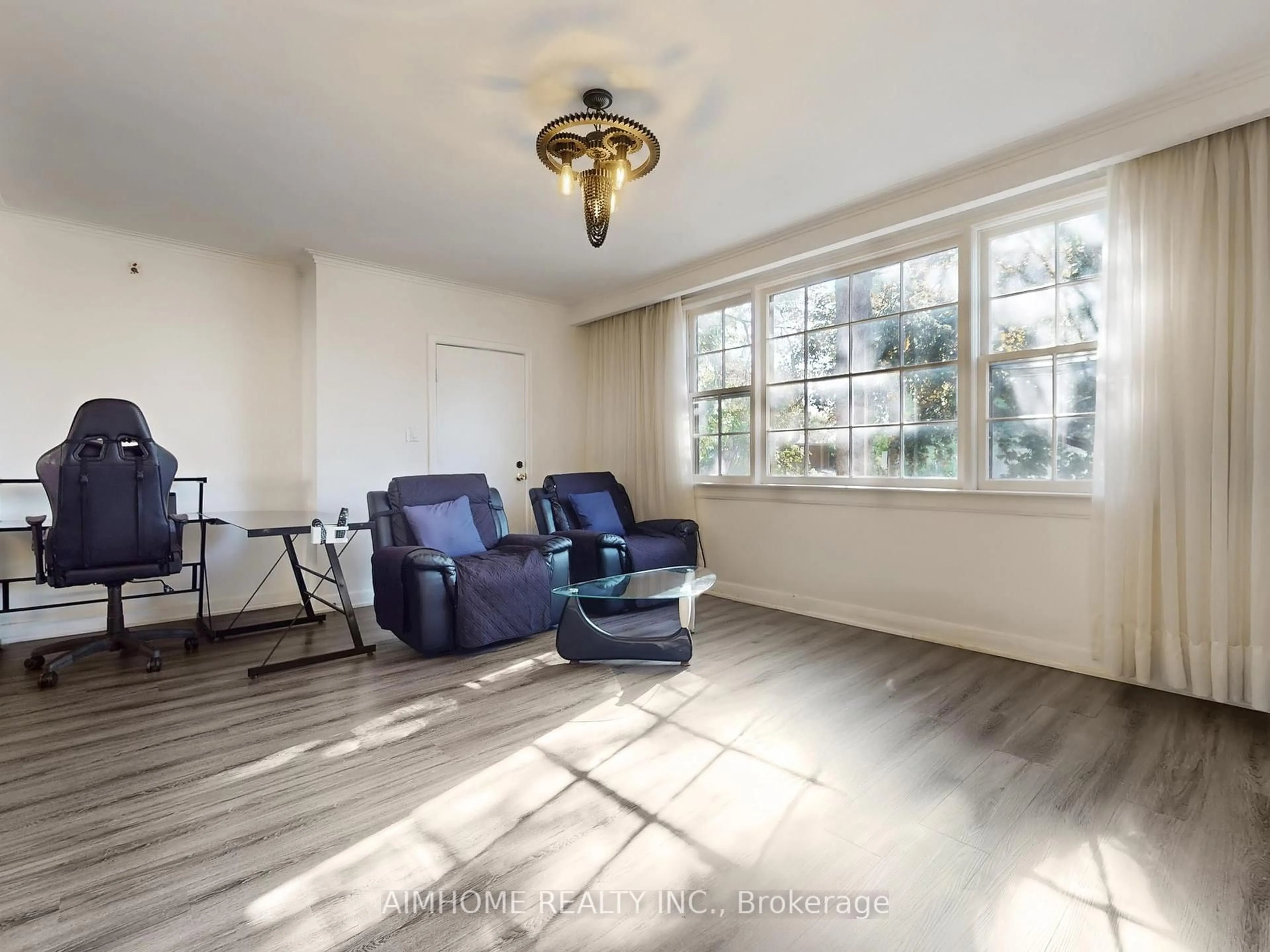 Living room with furniture, wood/laminate floor for 61 Talbot Rd, Toronto Ontario M2M 1S1