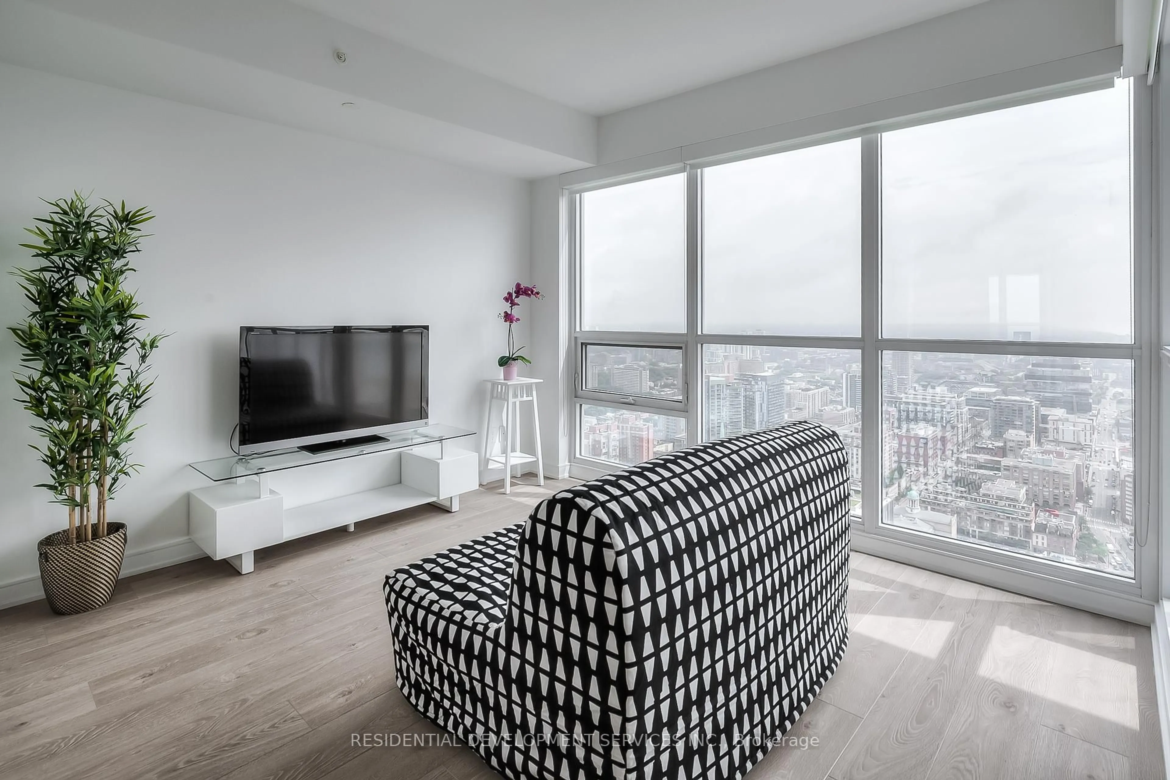 Living room with furniture, unknown for 88 Scott St #4306, Toronto Ontario M5E 0A9