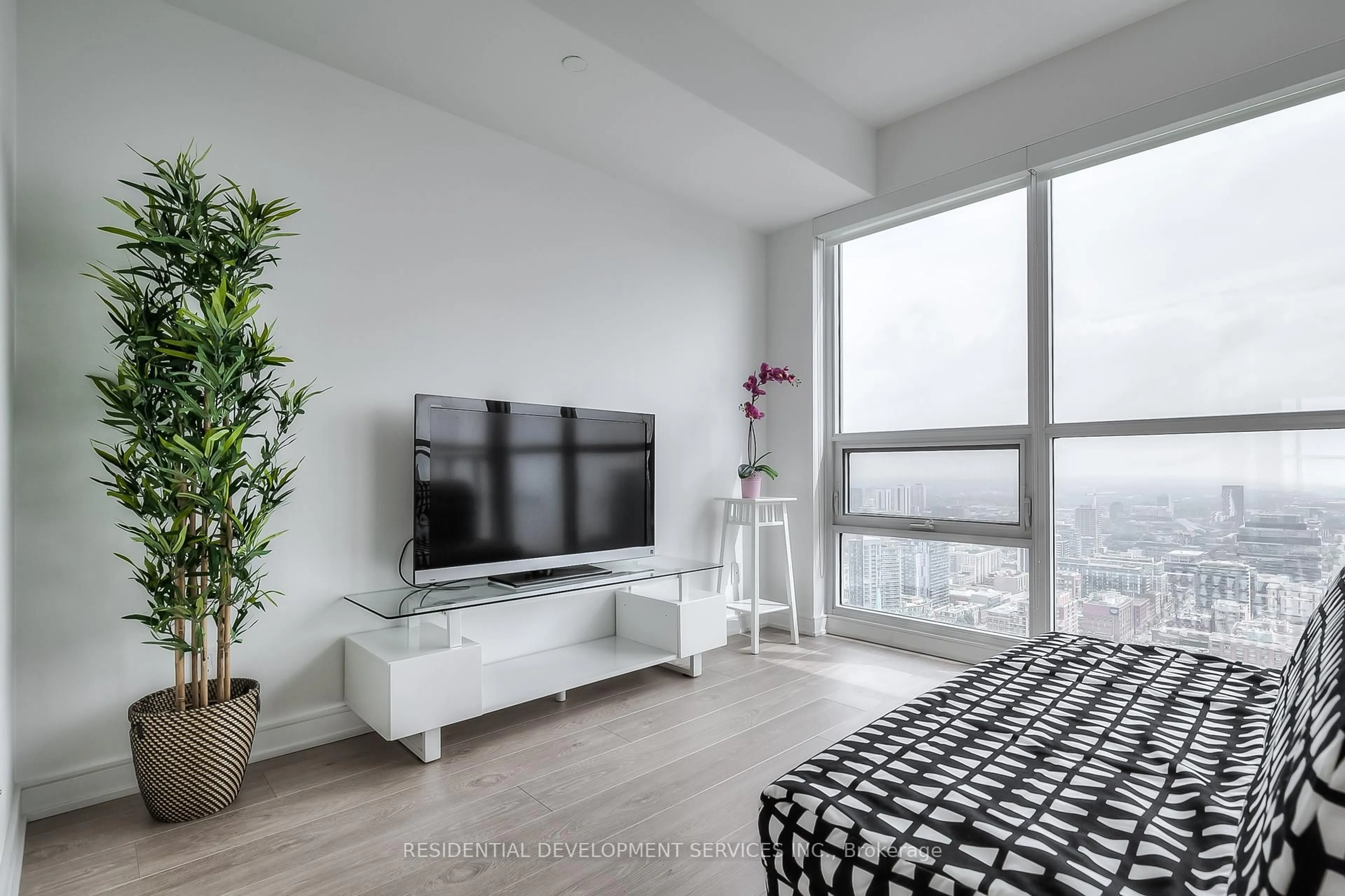 Living room with furniture, unknown for 88 Scott St #4306, Toronto Ontario M5E 0A9