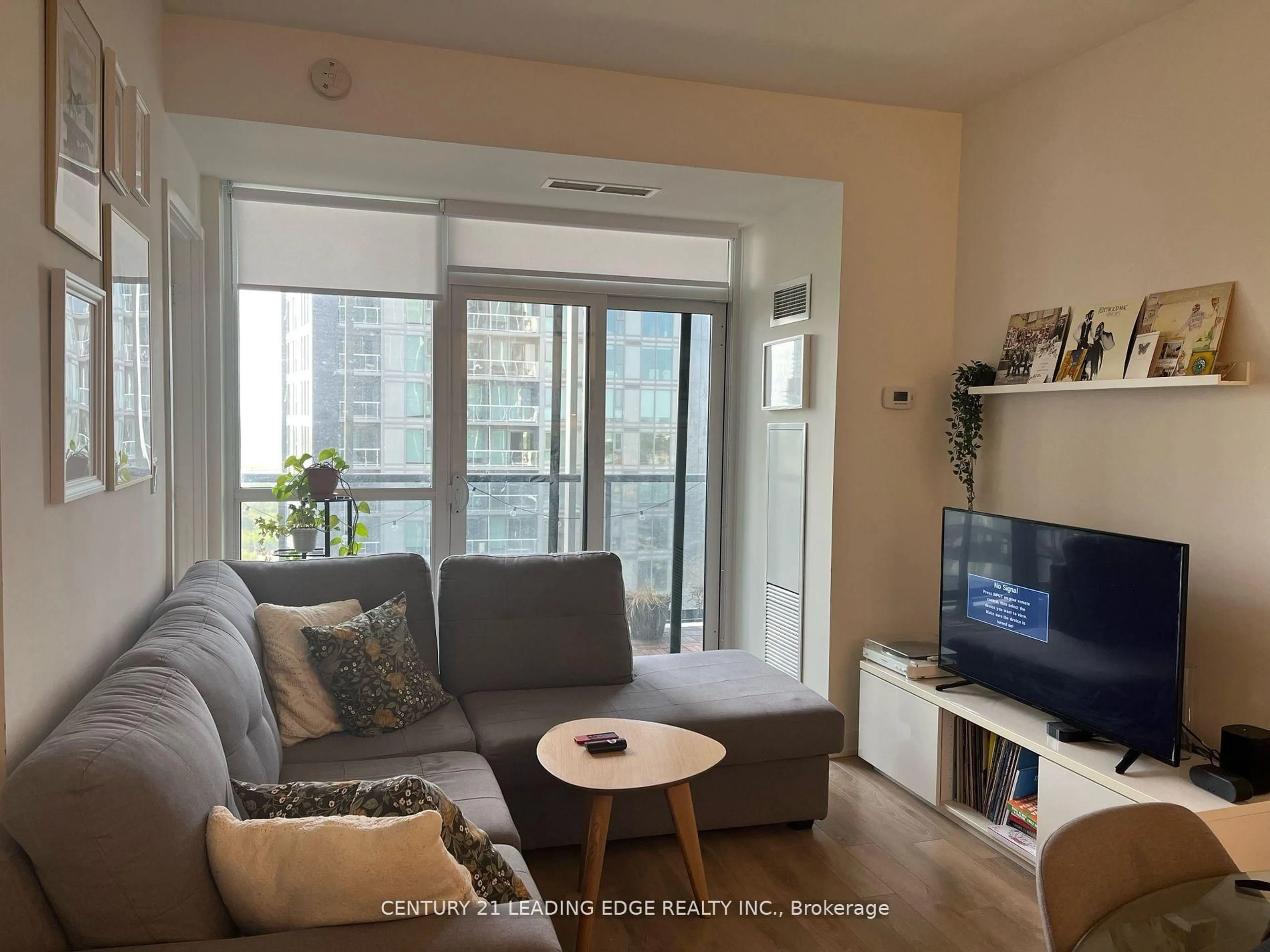 Living room with furniture, wood/laminate floor for 50 Ordnance St #1912, Toronto Ontario M6K 0C9