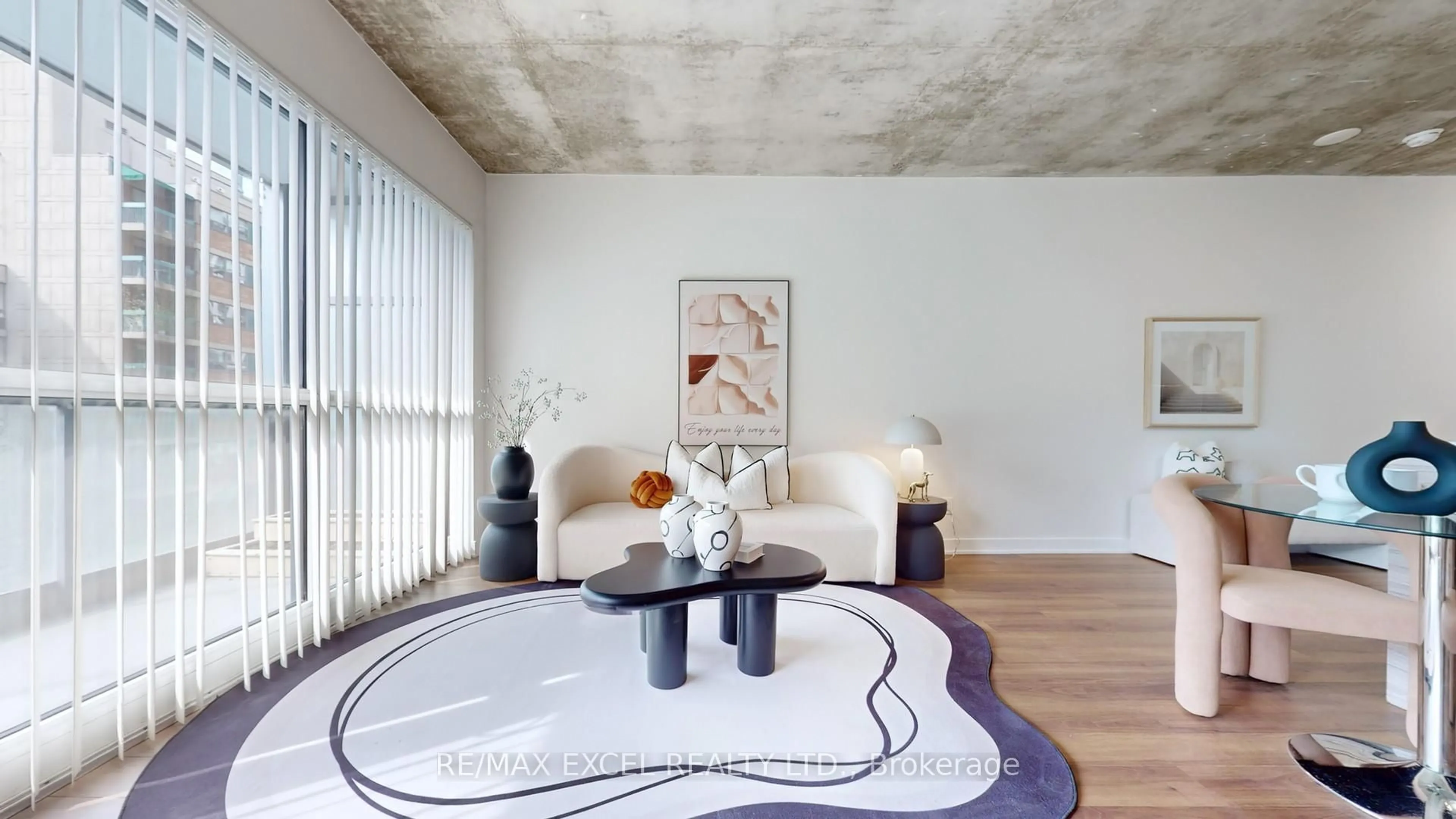 Living room with furniture, cement floor for 210 Simcoe St #704, Toronto Ontario M5T 1T4