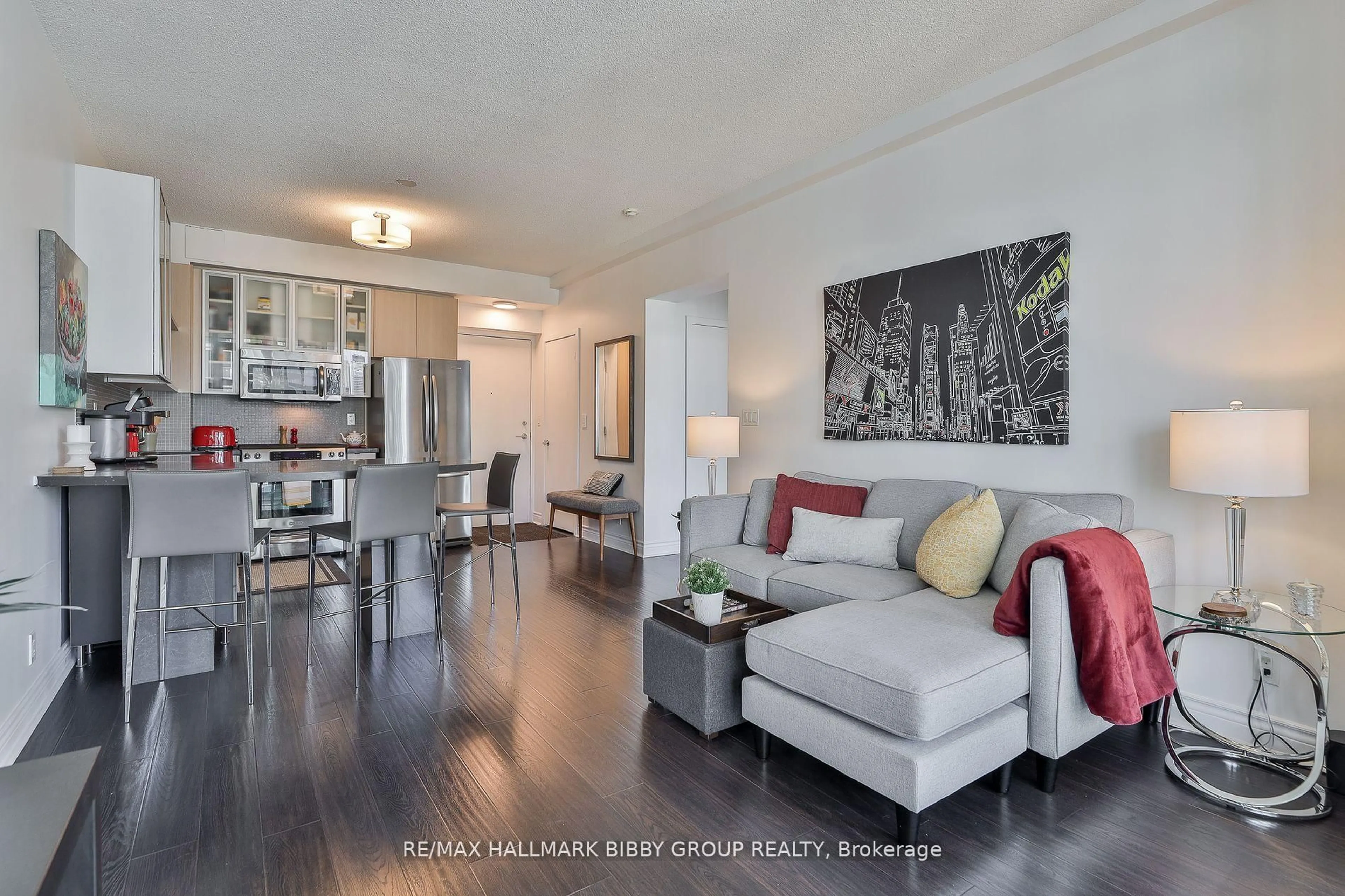 Living room with furniture, wood/laminate floor for 33 Lombard St #2204, Toronto Ontario M5C 3H8