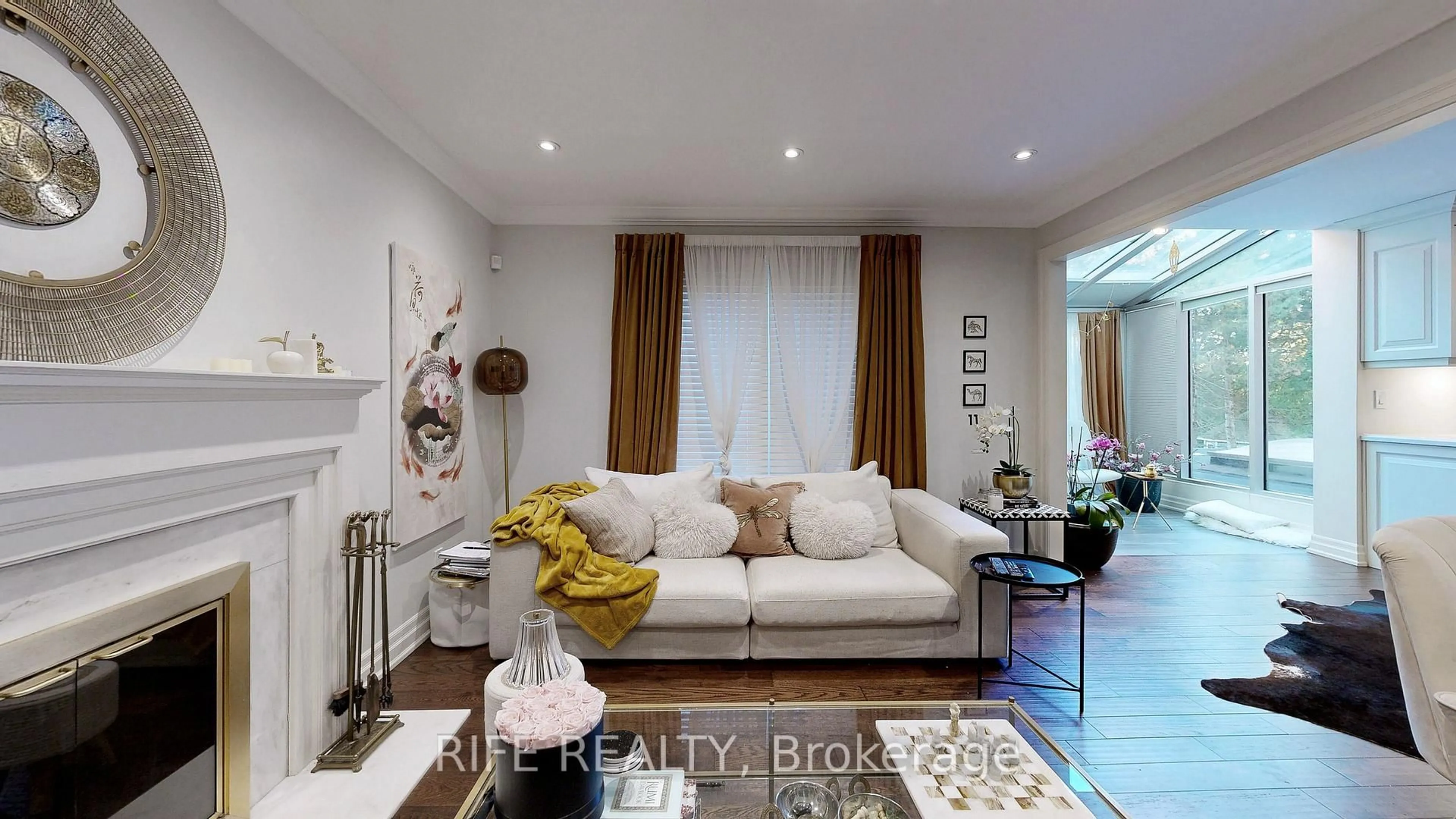 Living room with furniture, wood/laminate floor for 150 Abbeywood Tr, Toronto Ontario M3B 3B7