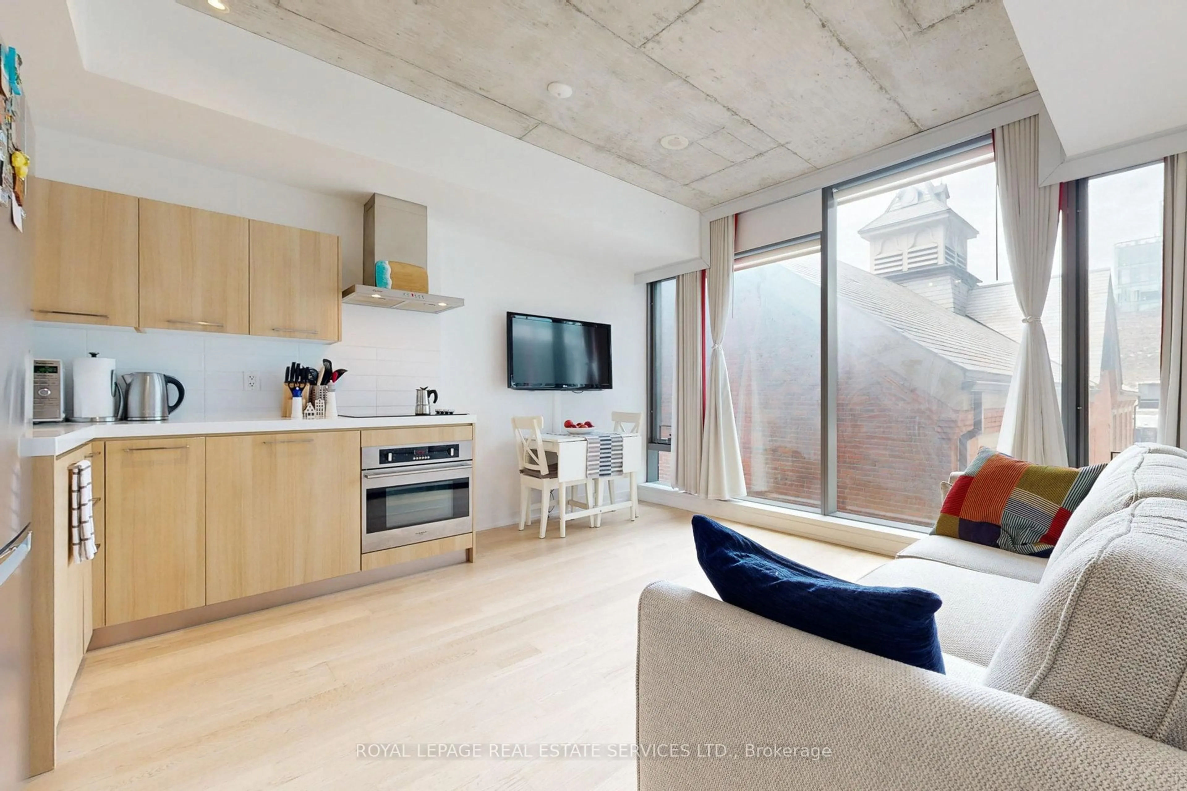 Living room with furniture, cement floor for 560 King St #417, Toronto Ontario M5V 1M3
