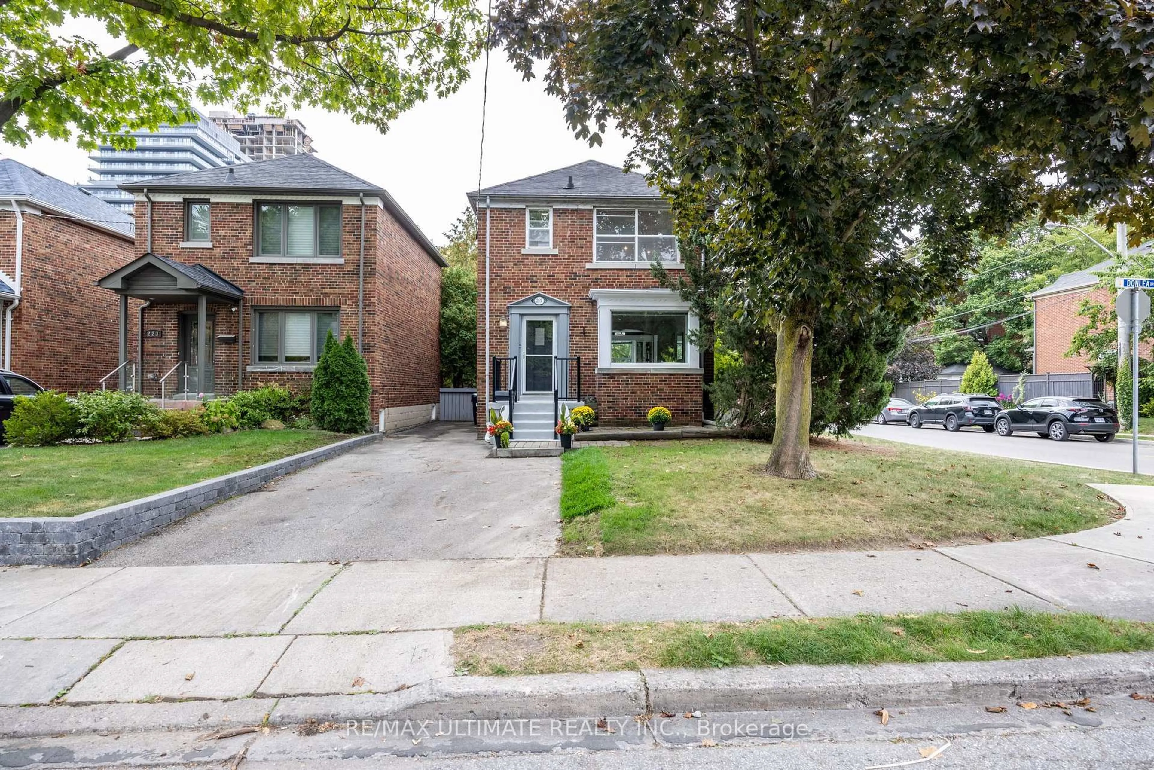 Home with brick exterior material, street for 221 Donlea Dr, Toronto Ontario M4G 2N3