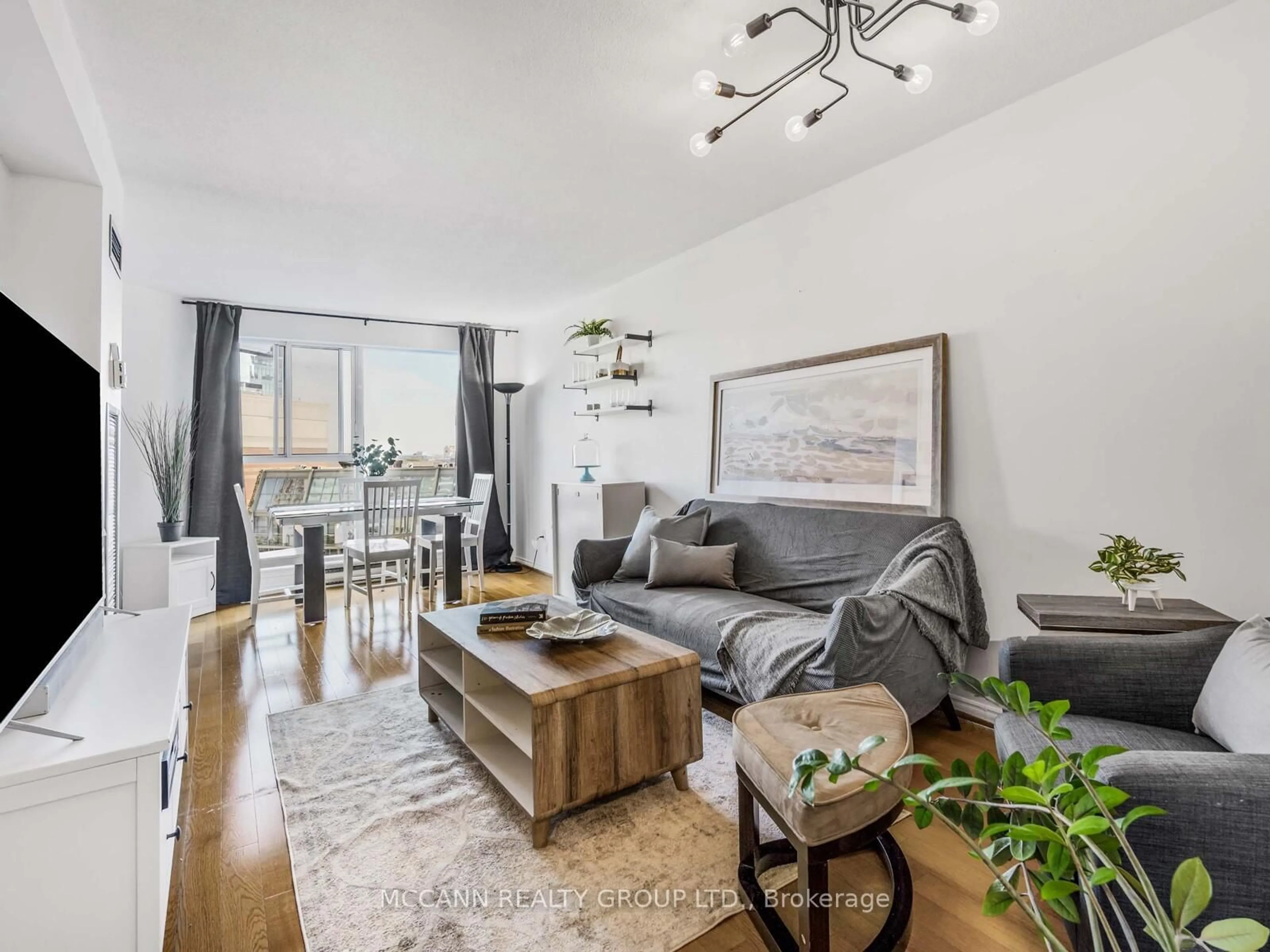 Living room with furniture, wood/laminate floor for 222 The Esplanade #904, Toronto Ontario M5A 4M8
