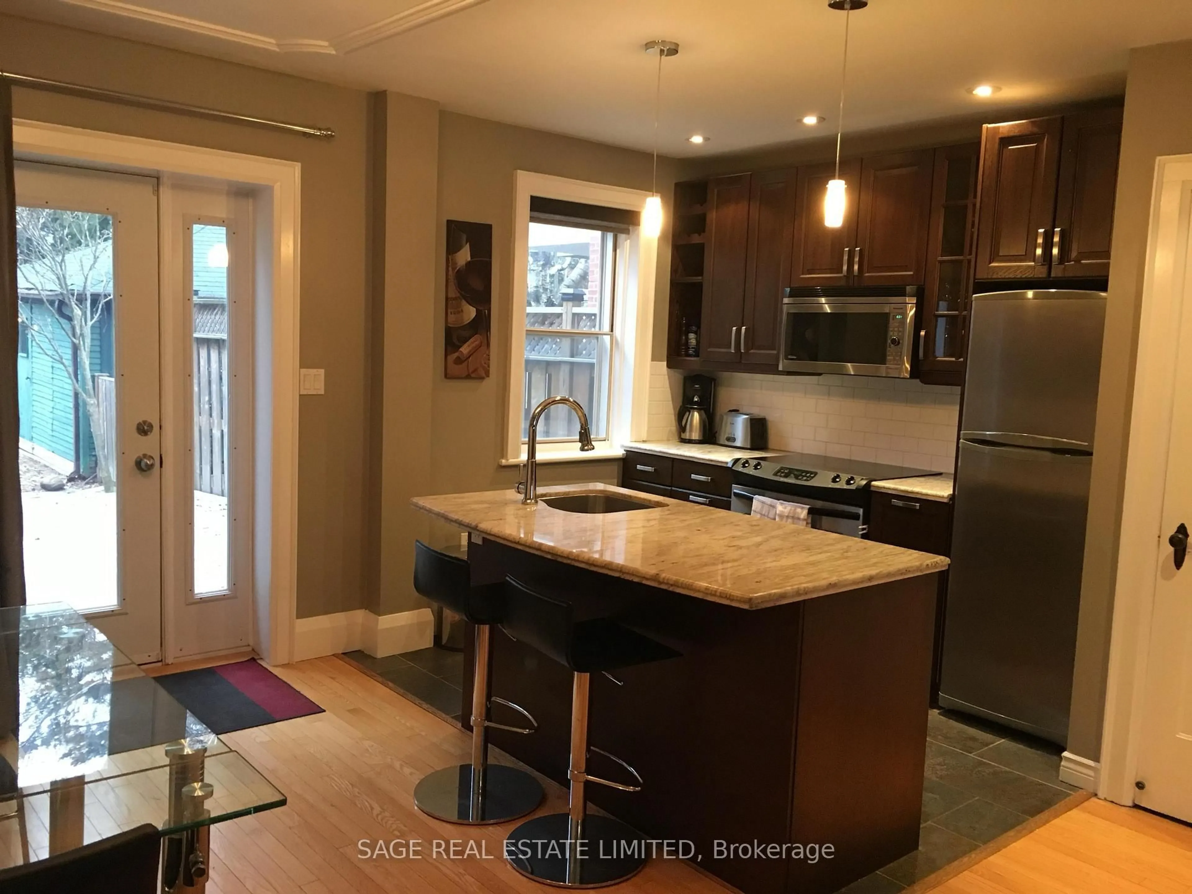 Open concept kitchen, wood/laminate floor for 569 Soudan Ave, Toronto Ontario M4S 1X1
