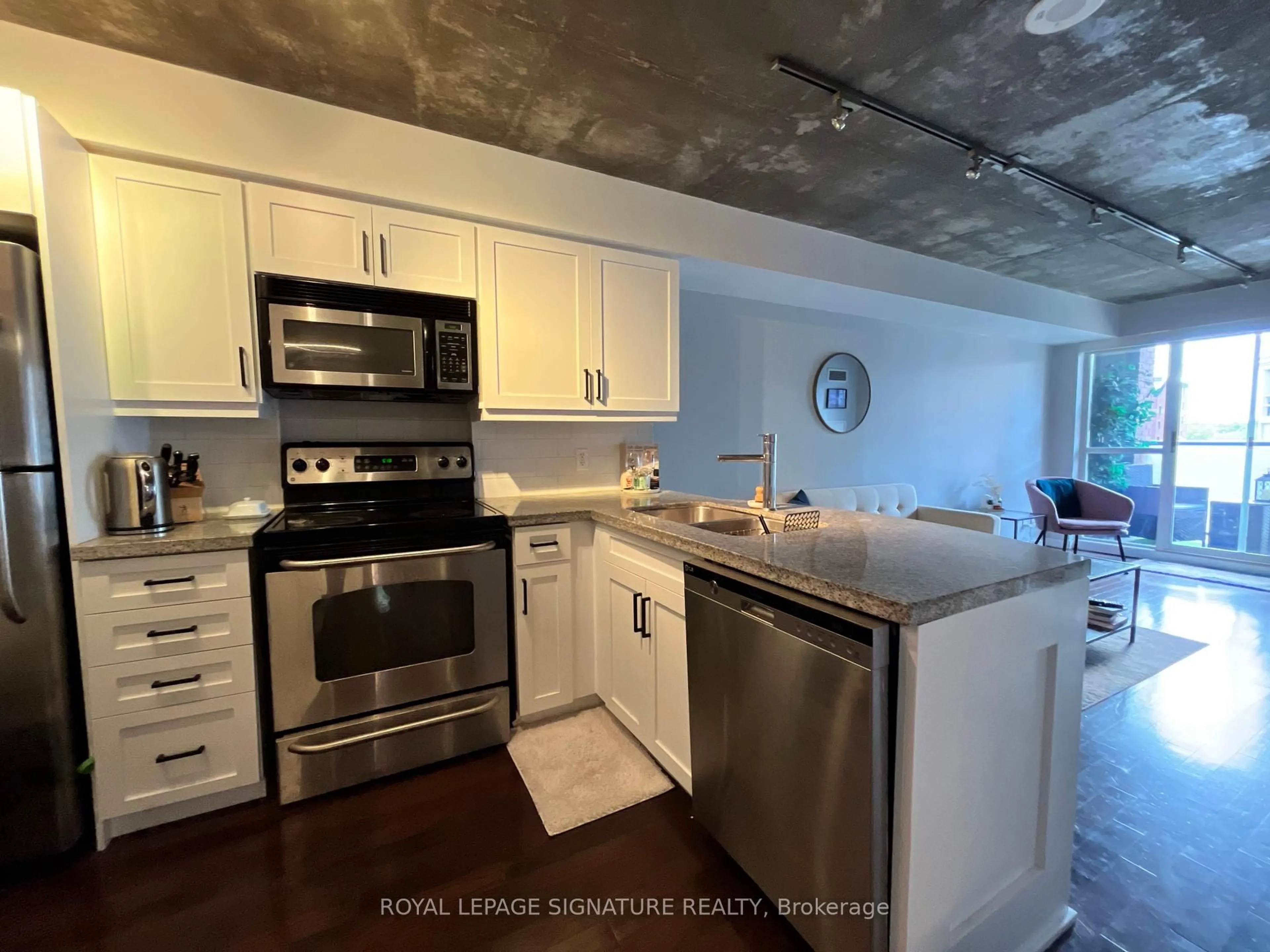 Kitchen with laundary machines, unknown for 1005 King St #610, Toronto Ontario M6K 3M8