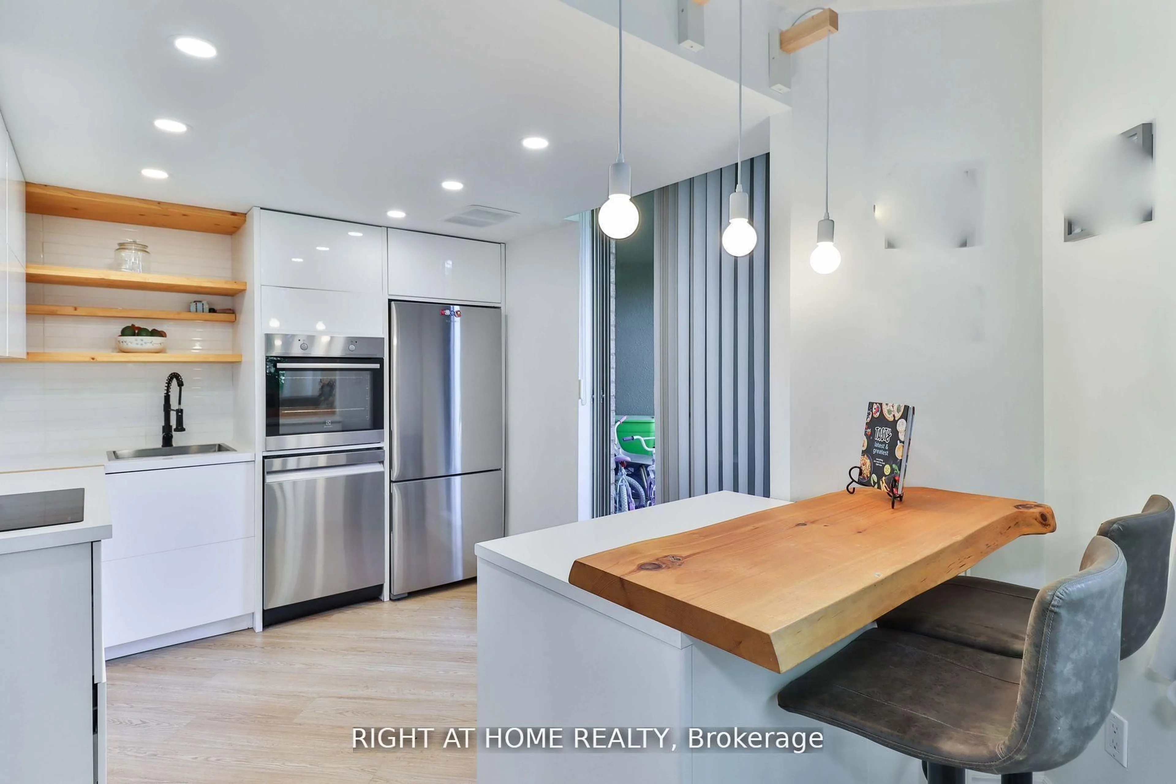 Contemporary kitchen, wood/laminate floor for 1210 Don Mills Rd #206, Toronto Ontario M3B 3N9