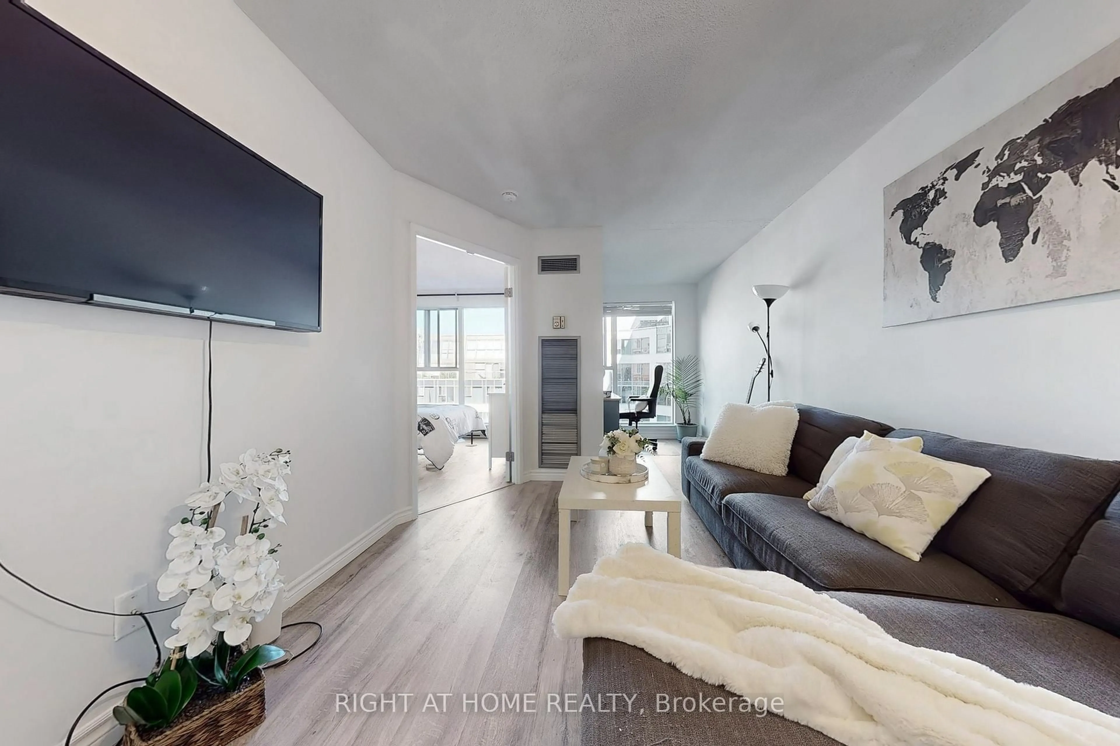 Living room with furniture, wood/laminate floor for 222 The Esplanade Ave #705, Toronto Ontario M5A 4M8