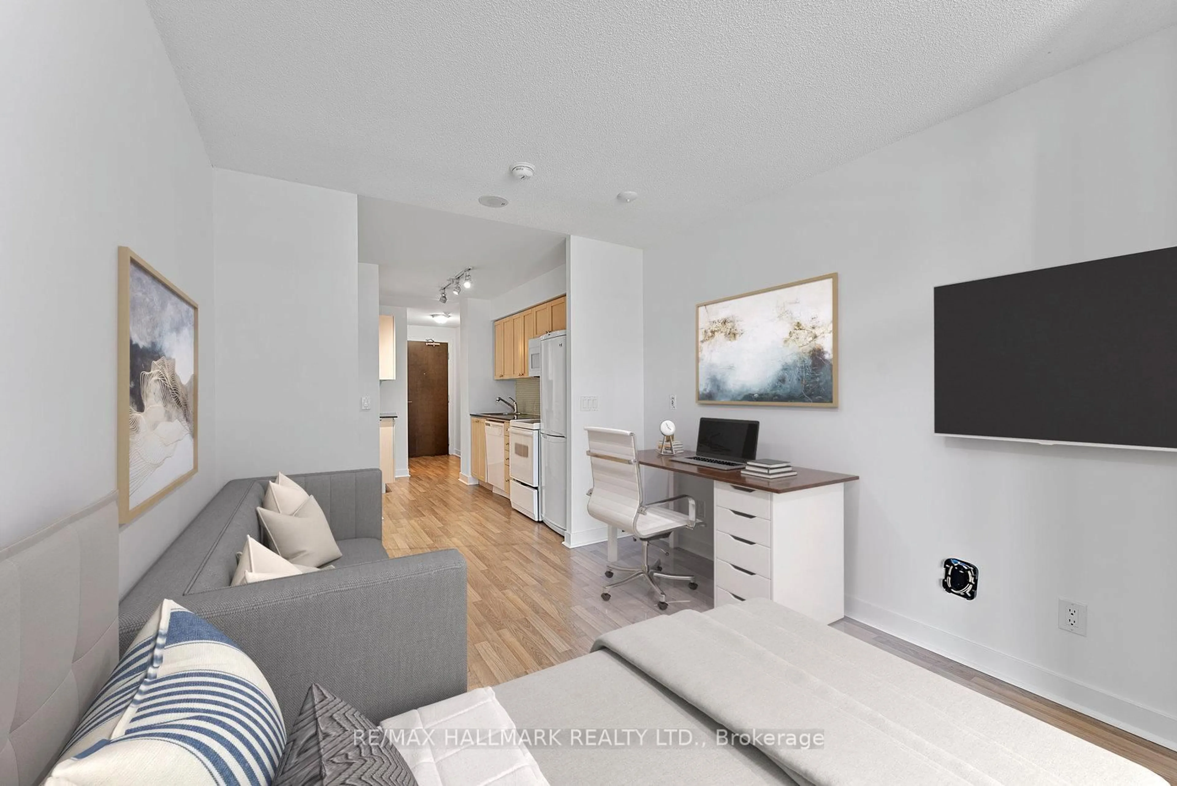Living room with furniture, wood/laminate floor for 50 Lynn Williams St #902, Toronto Ontario M6K 3R9