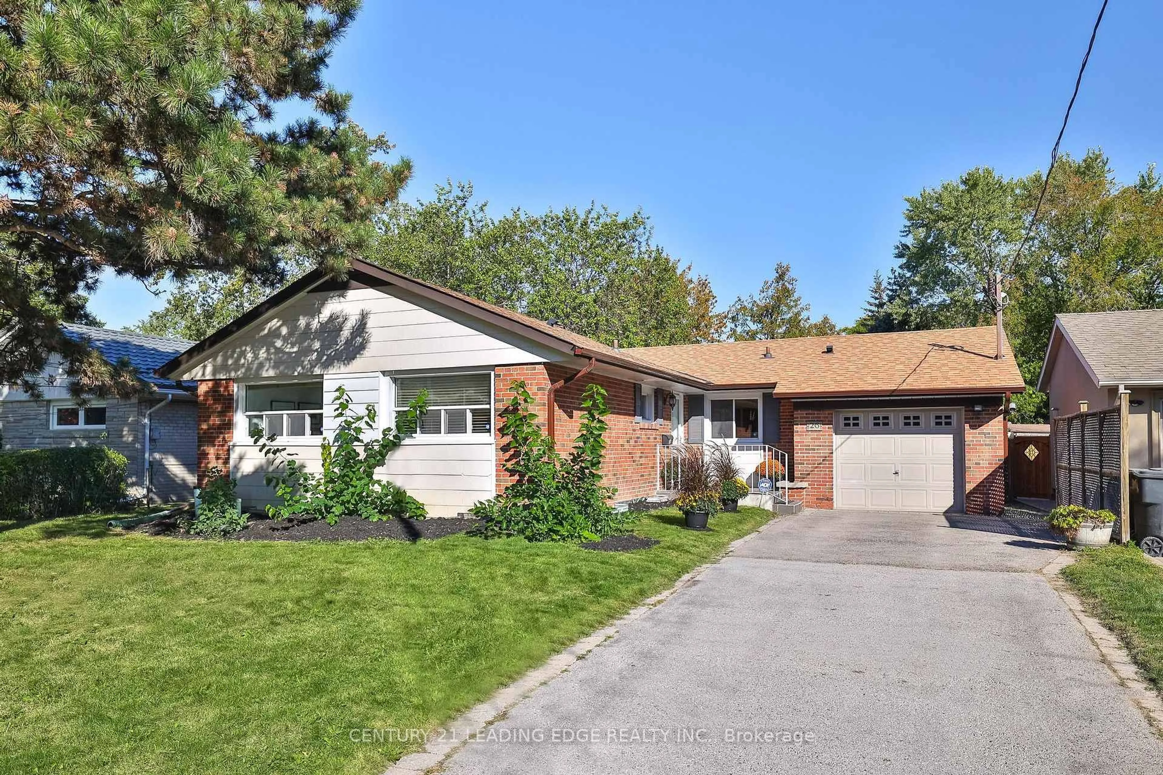 Home with brick exterior material, street for 26 ELVASTON Dr, Toronto Ontario M4A 1M9