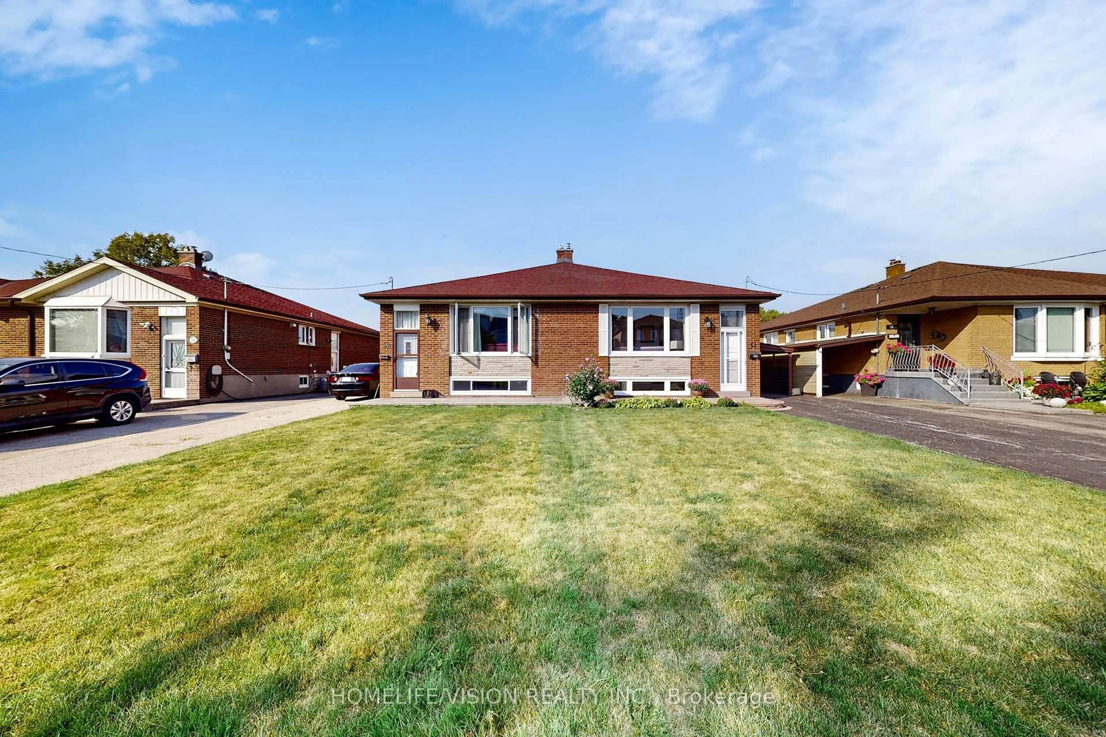 Home with brick exterior material, street for 54 Pinebrook Ave, Toronto Ontario M4A 1Z2