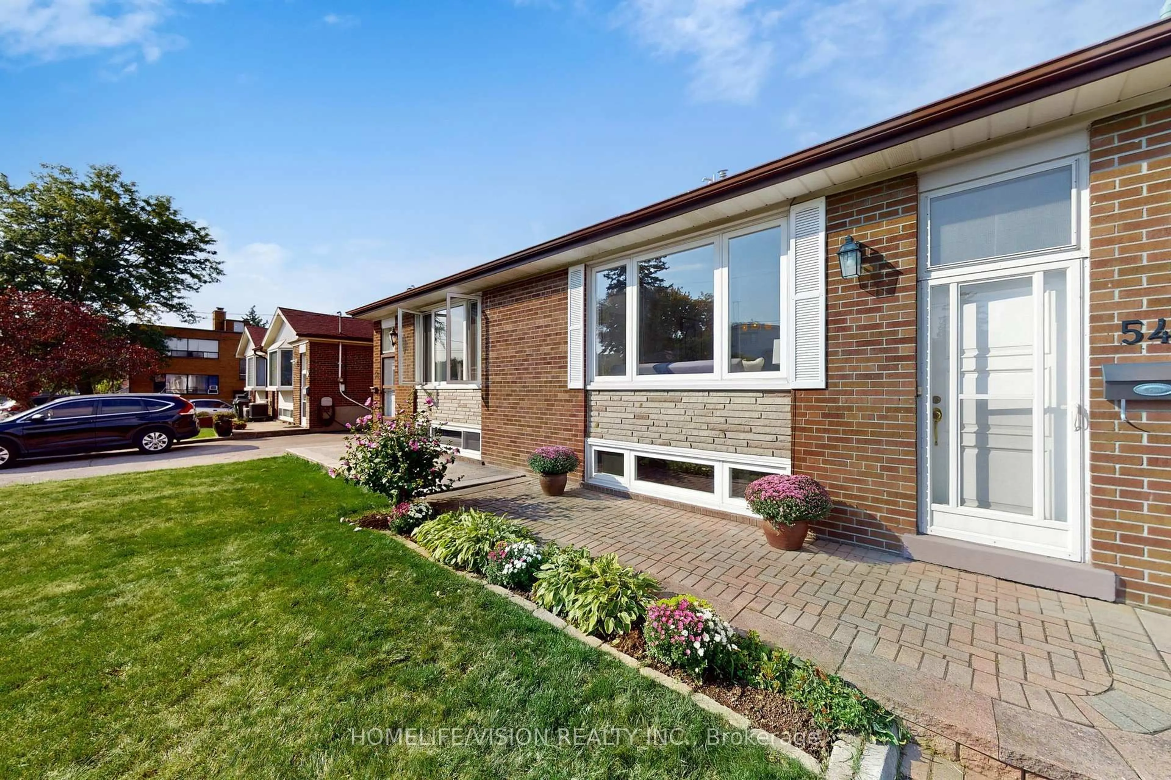 Home with brick exterior material, street for 54 Pinebrook Ave, Toronto Ontario M4A 1Z2