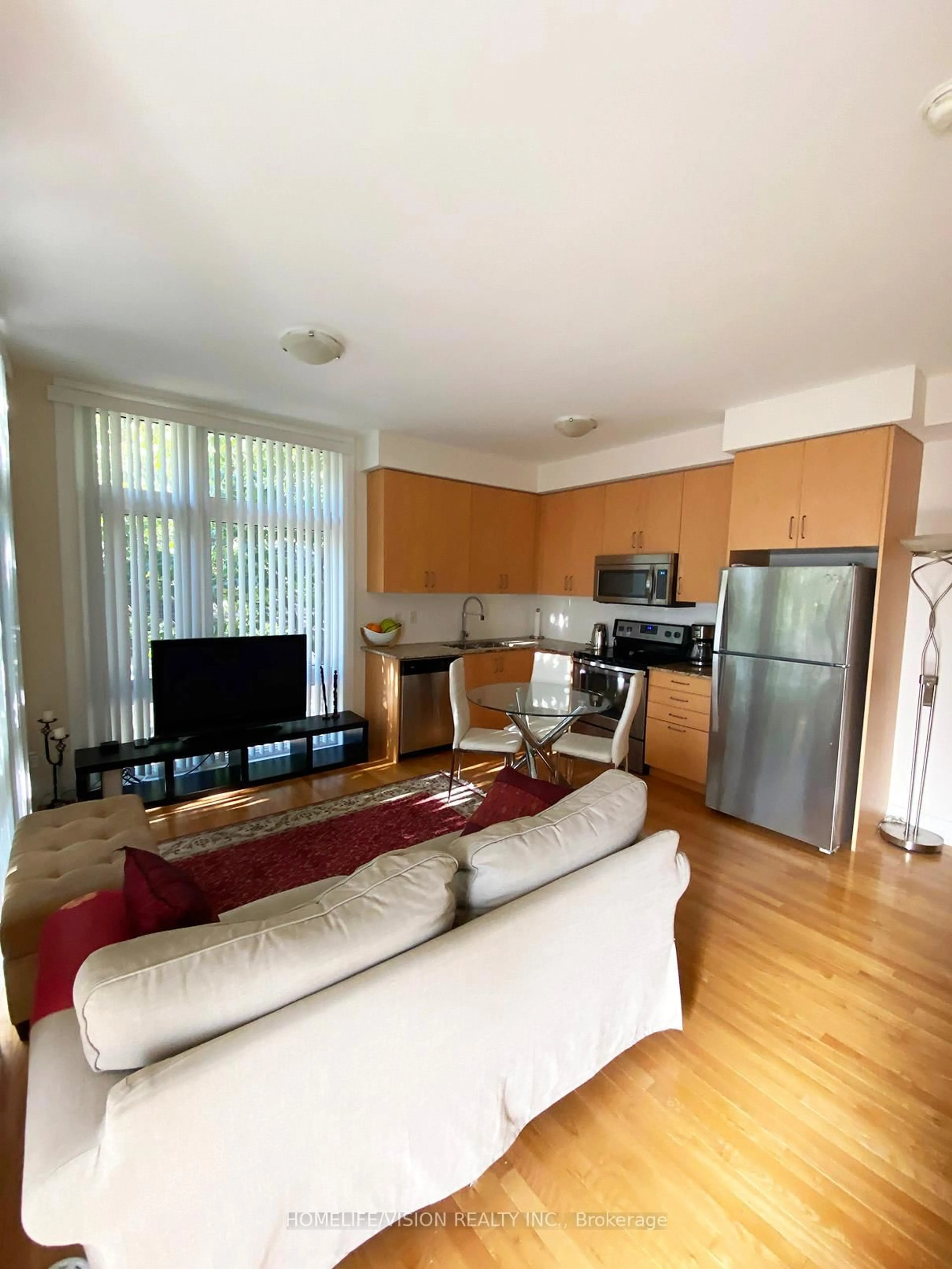 Living room with furniture, wood/laminate floor for 23 Eldora Ave #70, Toronto Ontario M2M 0B5