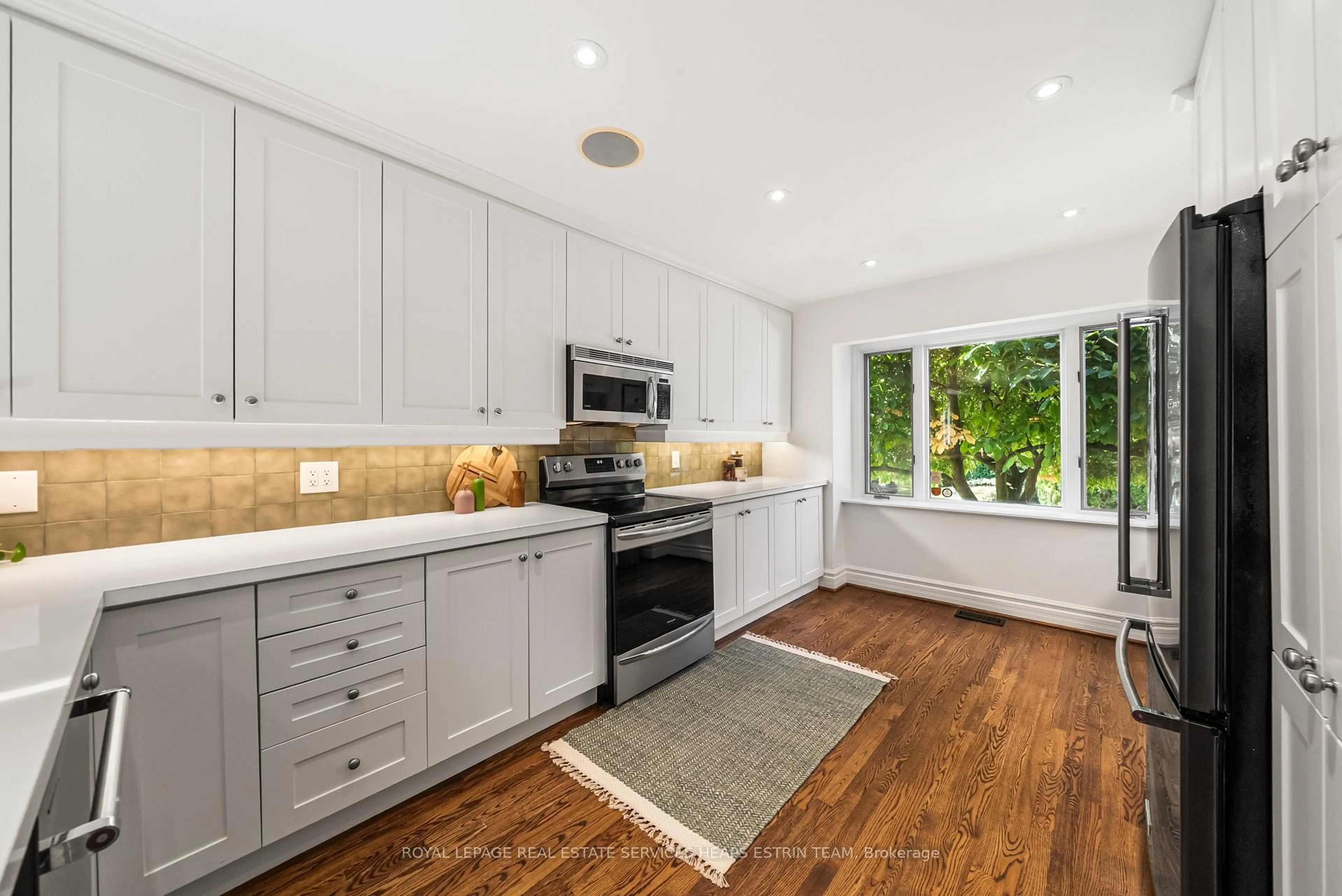 Open concept kitchen, ceramic/tile floor for 77 Astley Ave, Toronto Ontario M4W 3B5
