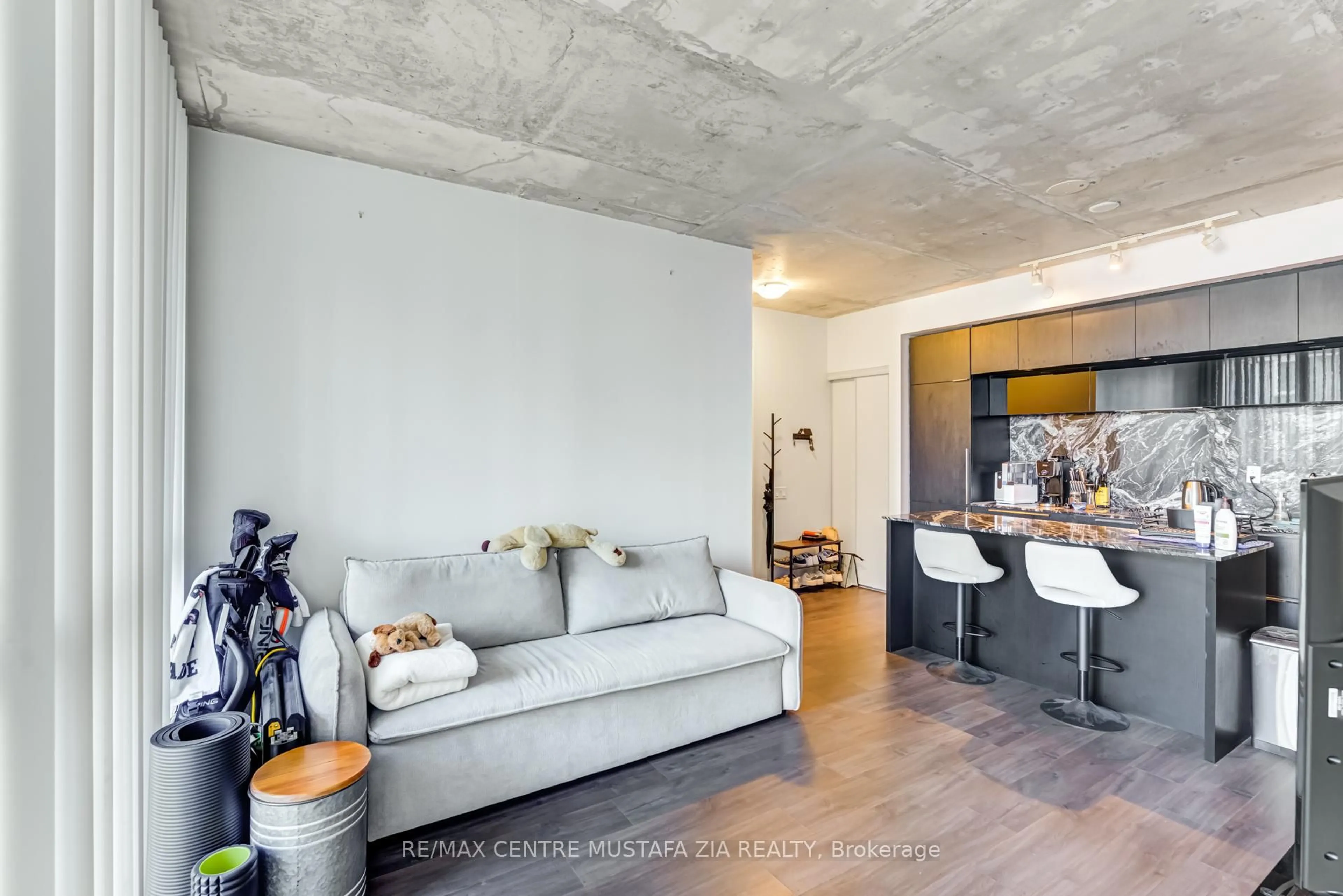 Living room with furniture, cement floor for 88 Blue Jays Way #2501, Toronto Ontario M5V 2G3