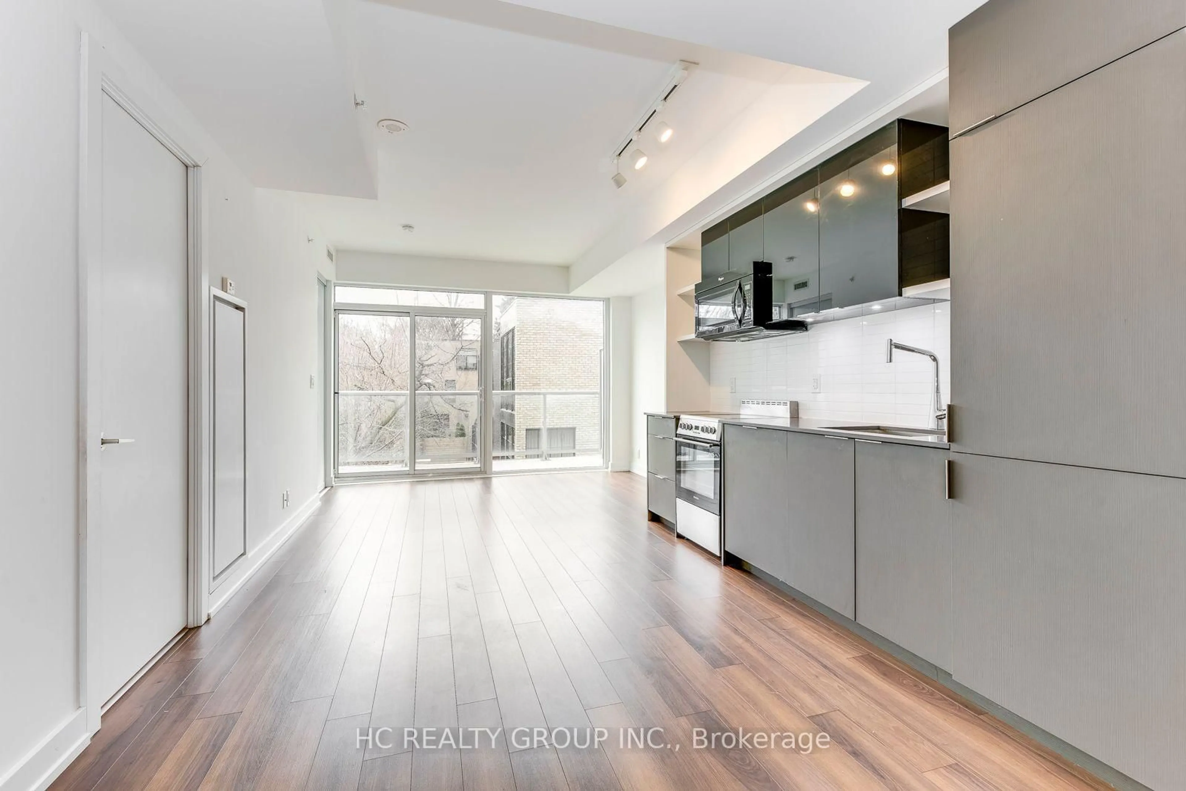 Open concept kitchen, wood/laminate floor for 6 Parkwood Ave #302, Toronto Ontario M4V 0A3