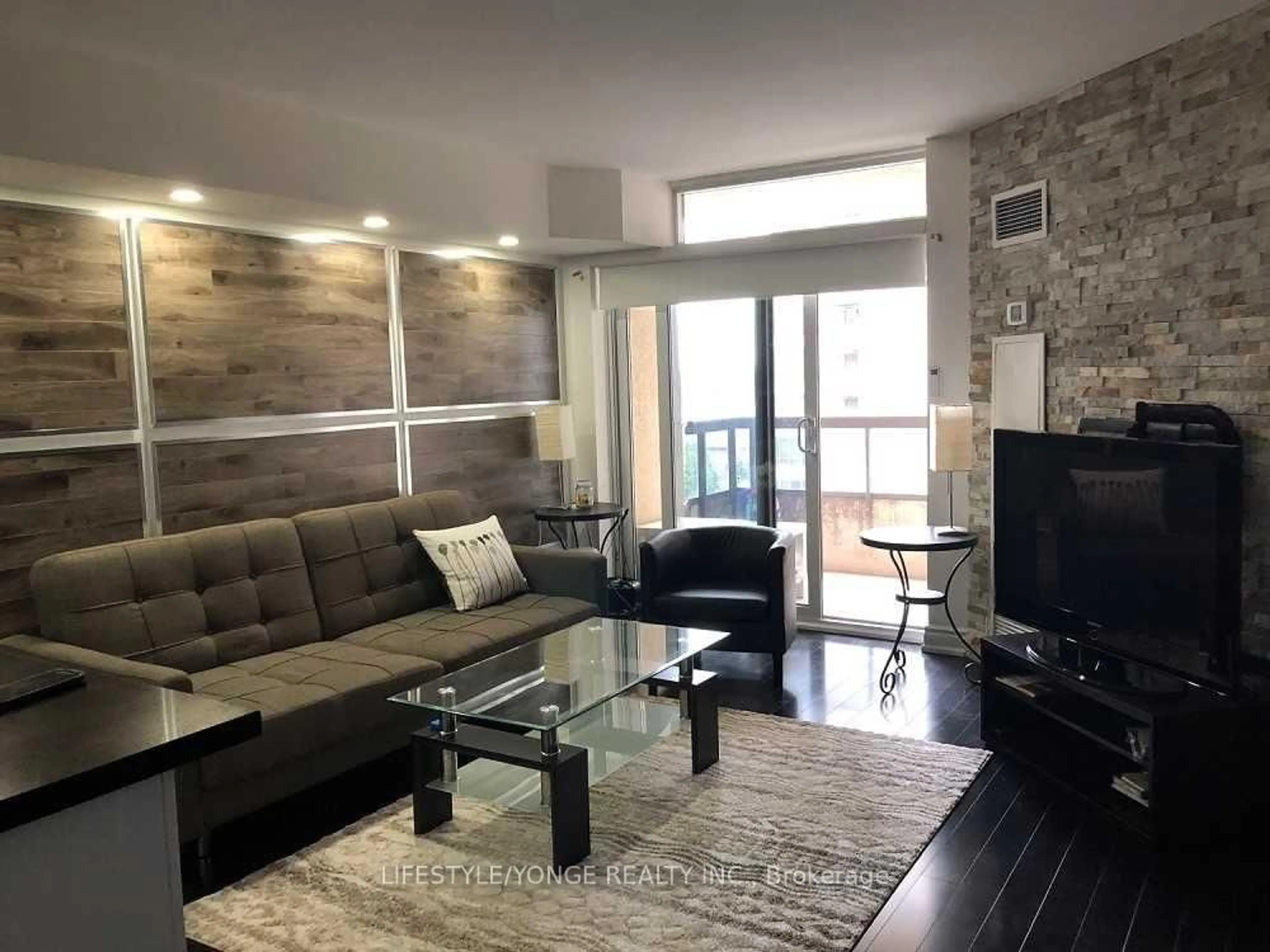 Living room with furniture, wood/laminate floor for 5 Northtown Way #909, Toronto Ontario M2N 7A1