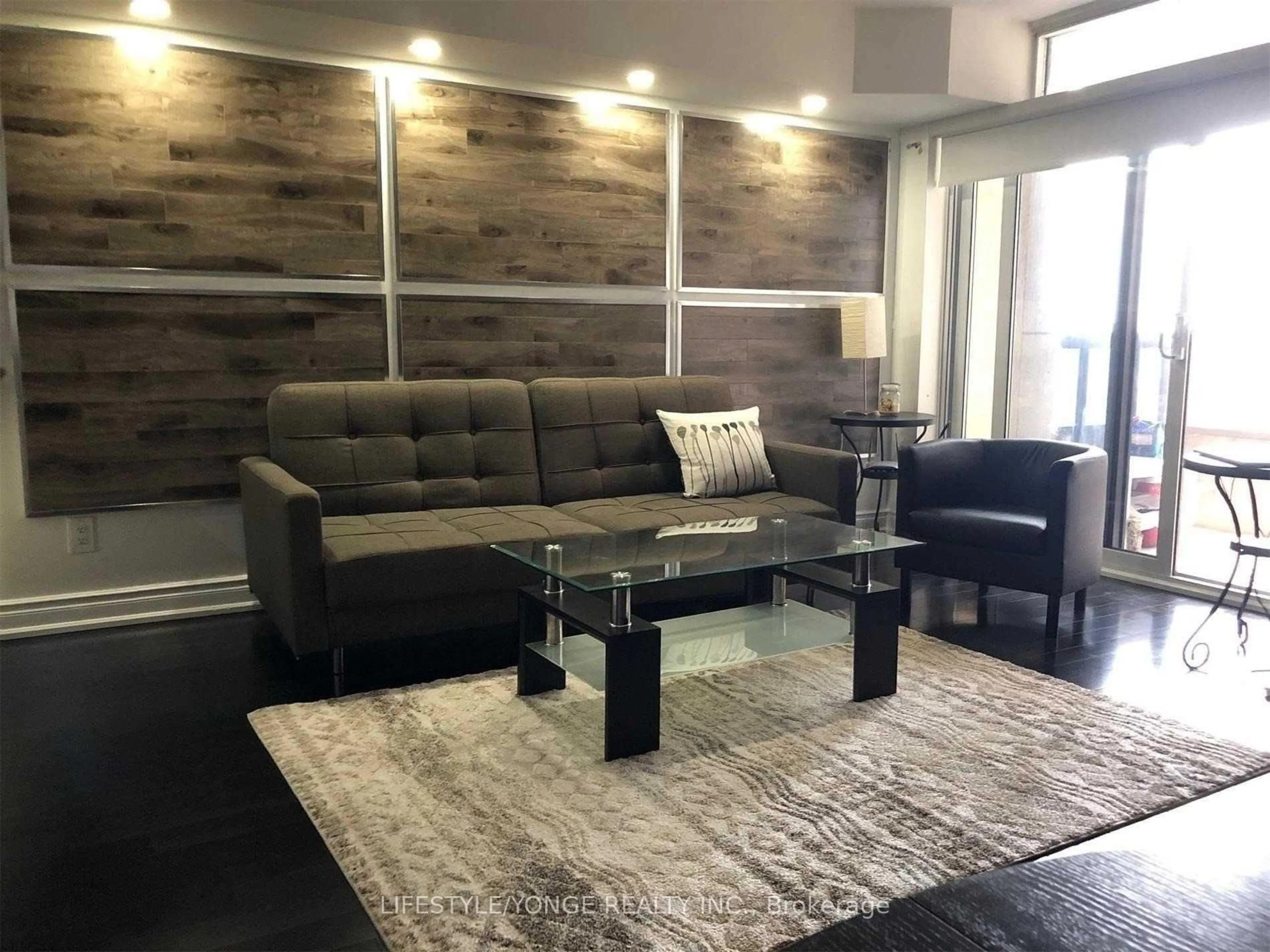 Living room with furniture, wood/laminate floor for 5 Northtown Way #909, Toronto Ontario M2N 7A1