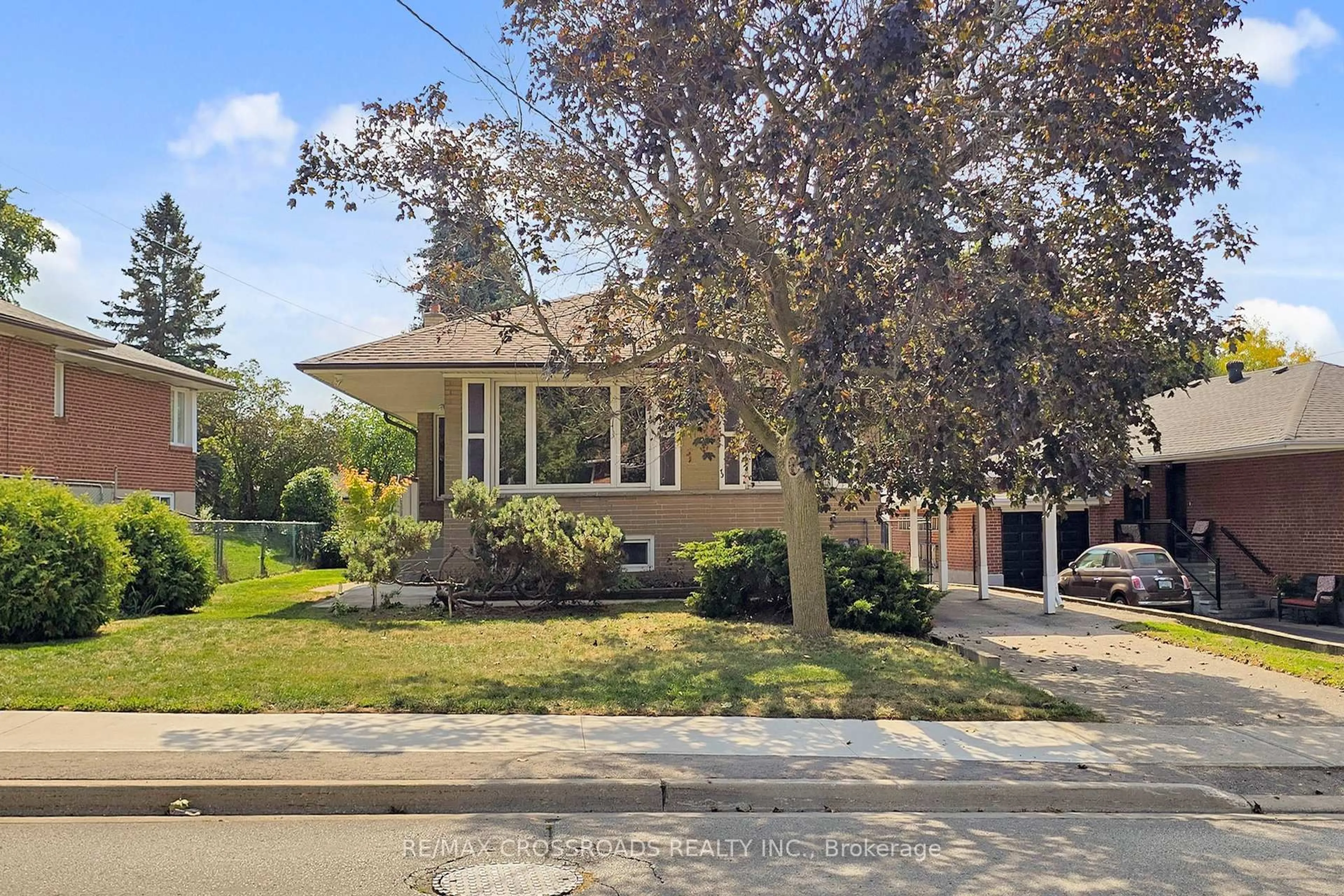 Home with brick exterior material, street for 55 Elvaston Dr, Toronto Ontario M4A 1N2